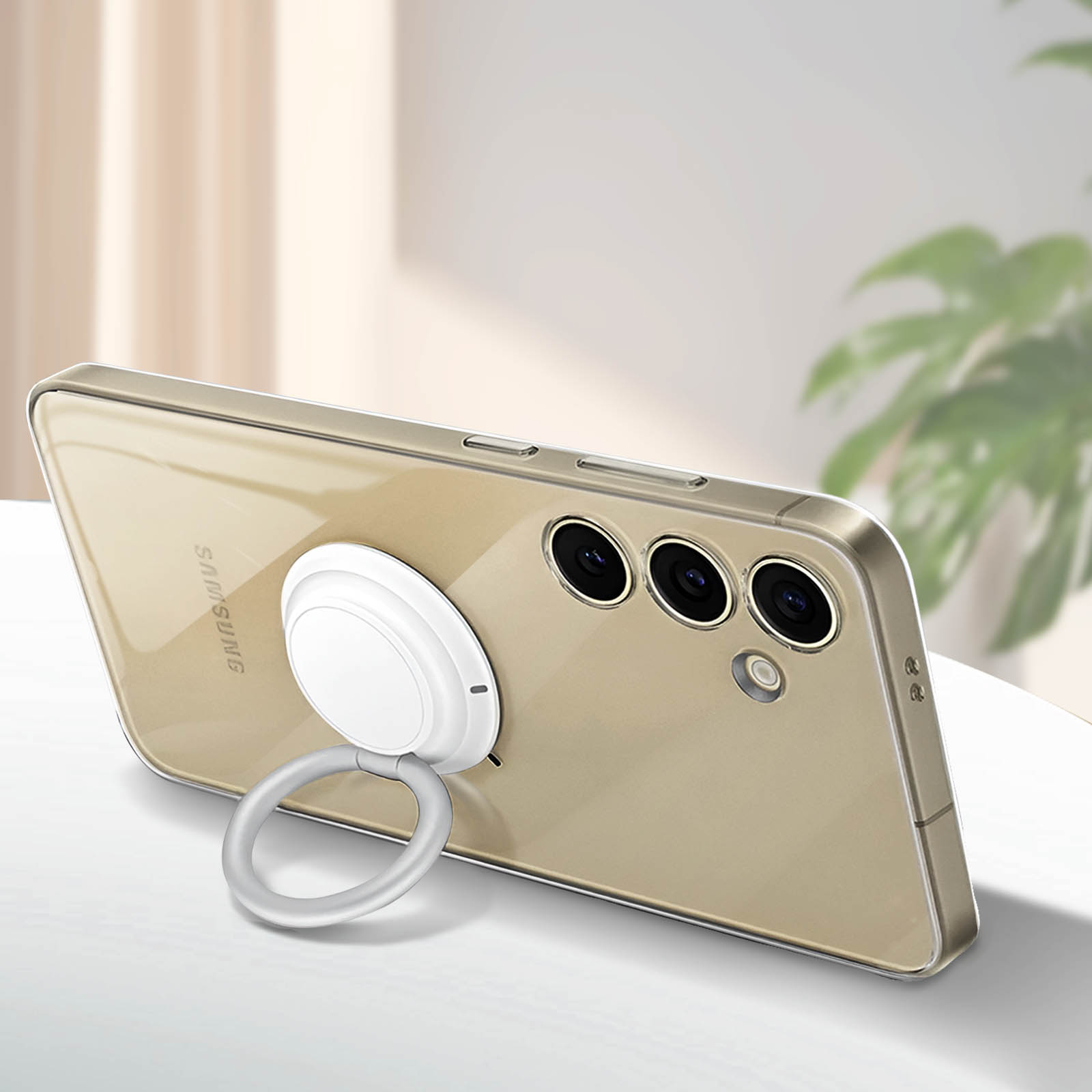 Coque de téléphone dorée avec un support d'anneau blanc attaché. Le téléphone est face vers le haut.