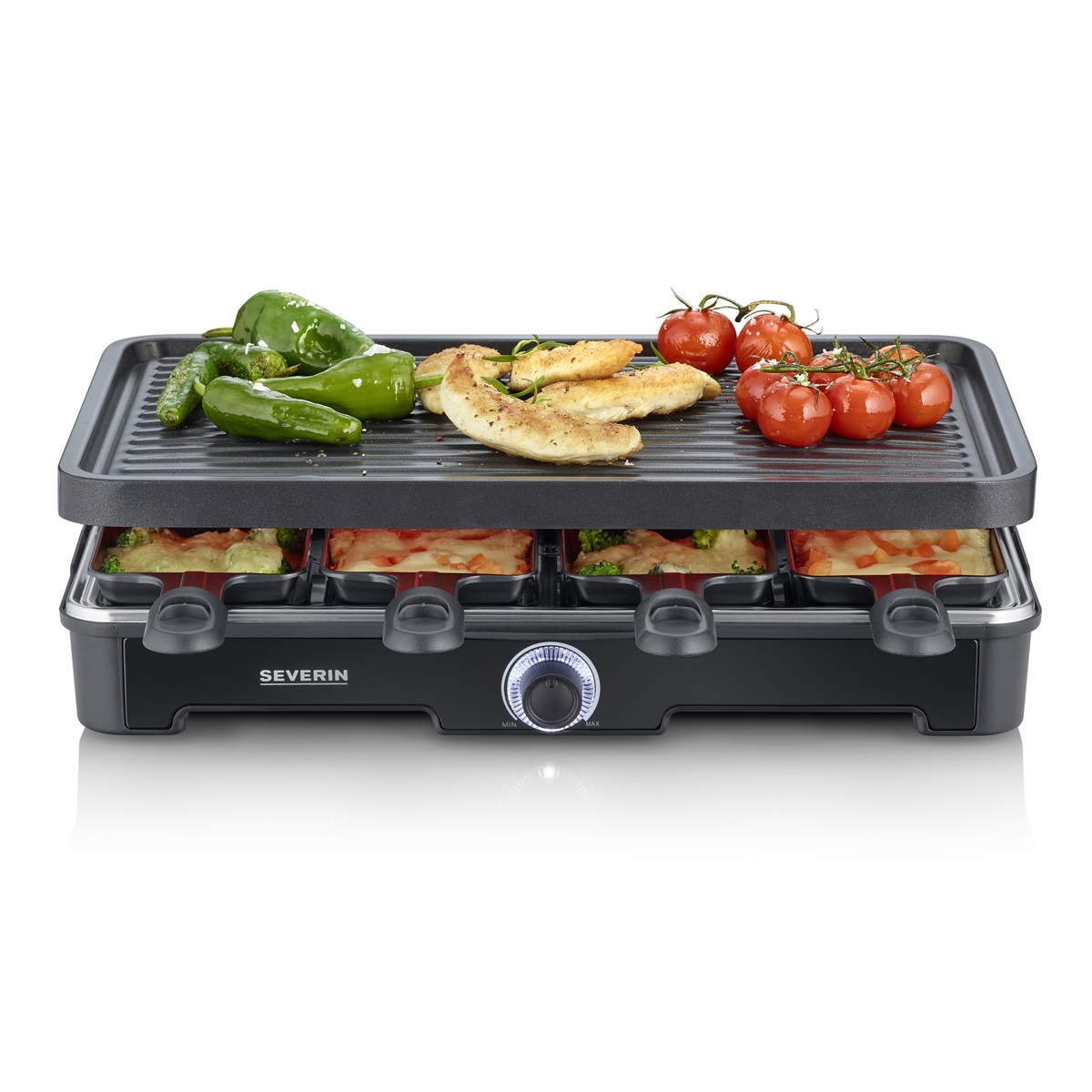 Grill do raclette z warzywami i gotowym jedzeniem na wierzchu oraz serem poniżej.