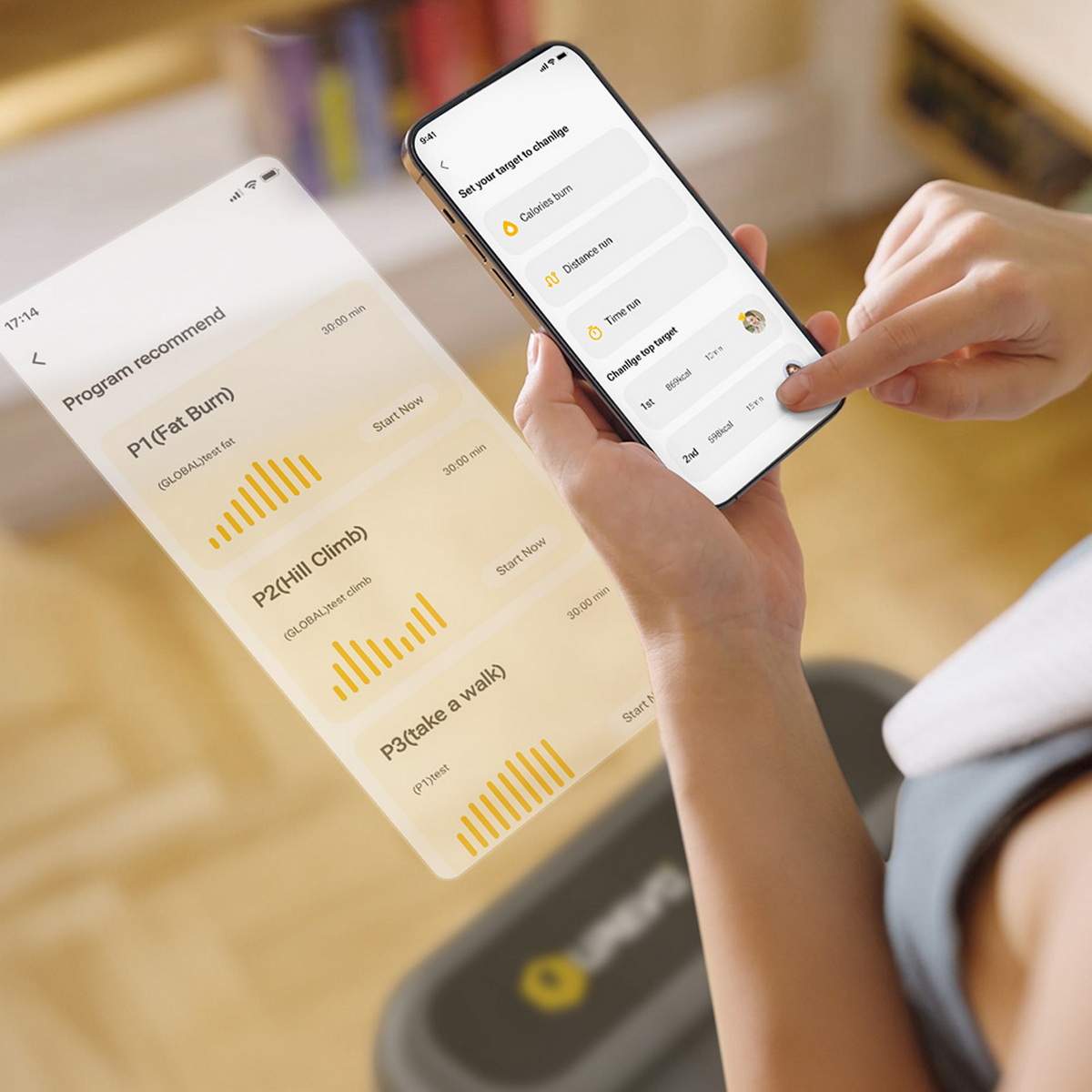 Ręce trzymające smartfon z aplikacją do ćwiczeń. Wyświetla programy treningowe.
