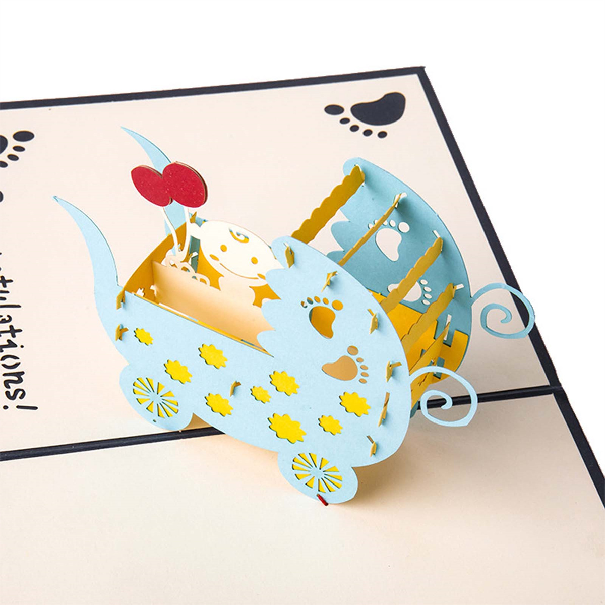 Pop-up-Grußkarte in Blau, mit einem Kinderwagendesign und Babyfüßen.