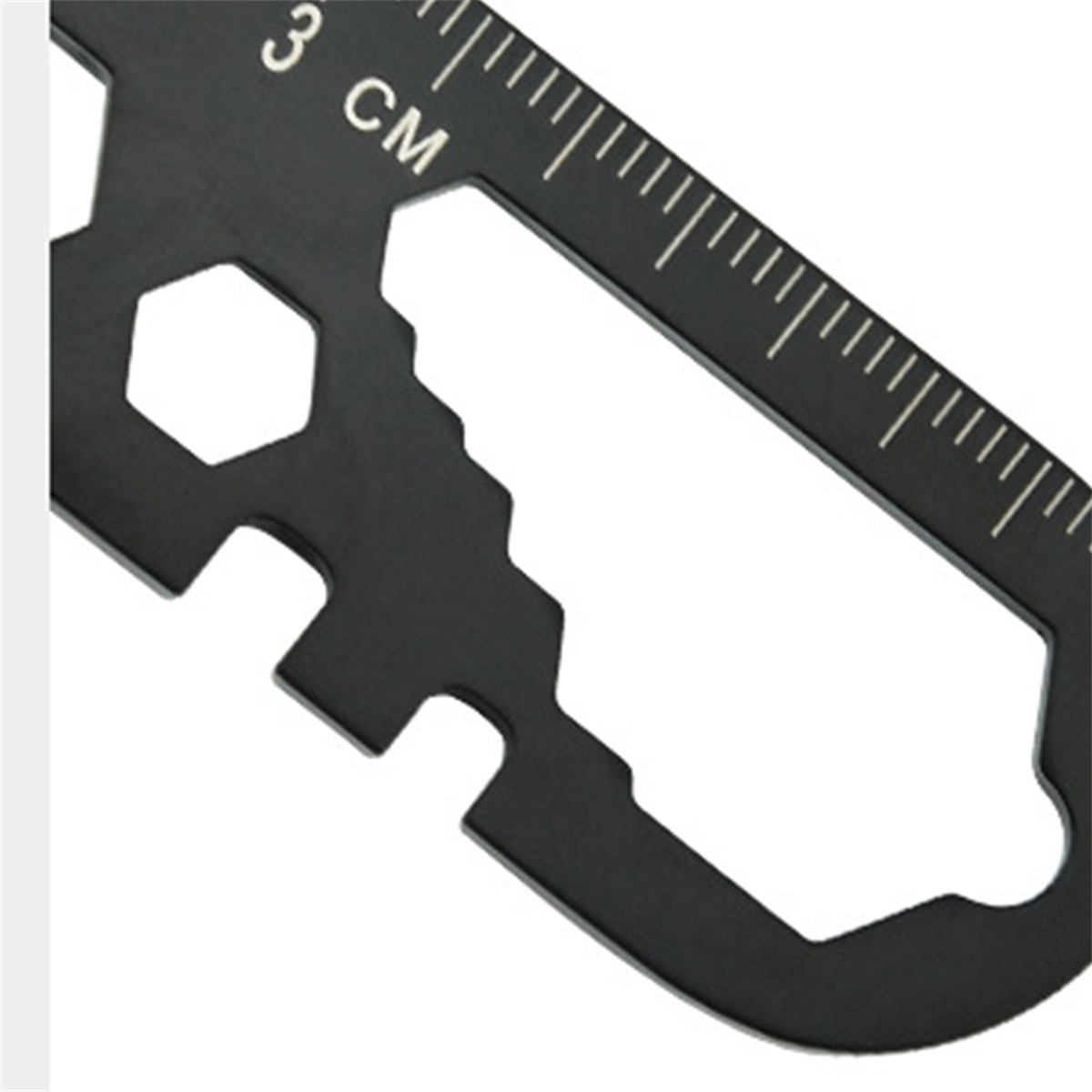 Nahaufnahme eines schwarzen Multi-Tools mit Linealmarkierungen und verschiedenen Aussparungen.