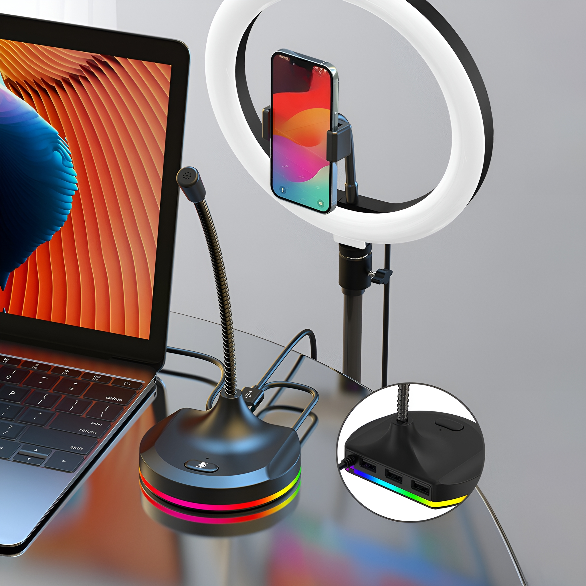 Ein Mikrofon mit Ringlicht-Setup. Der Hintergrund hat einen Laptop und ein Telefon. Die Basis hat mehrfarbige Lichter.