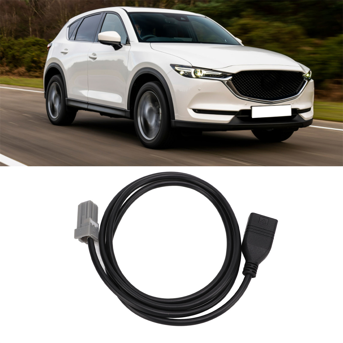 Ein weißer SUV ist auf einer Straße. Darunter ein schwarzes Kabel mit Steckern.
