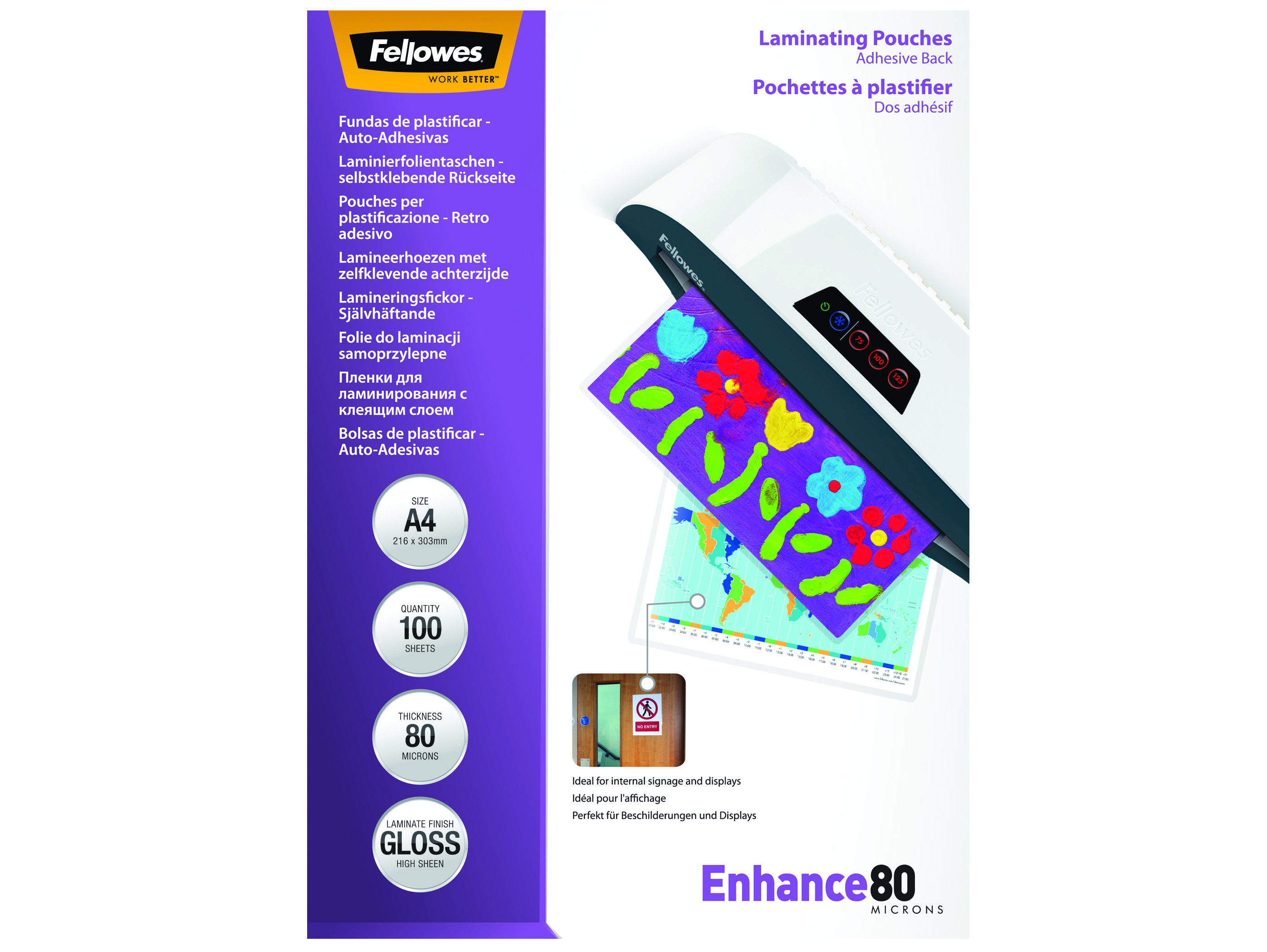 Une boîte de pochettes de plastification et une plastifieuse sur une surface blanche.