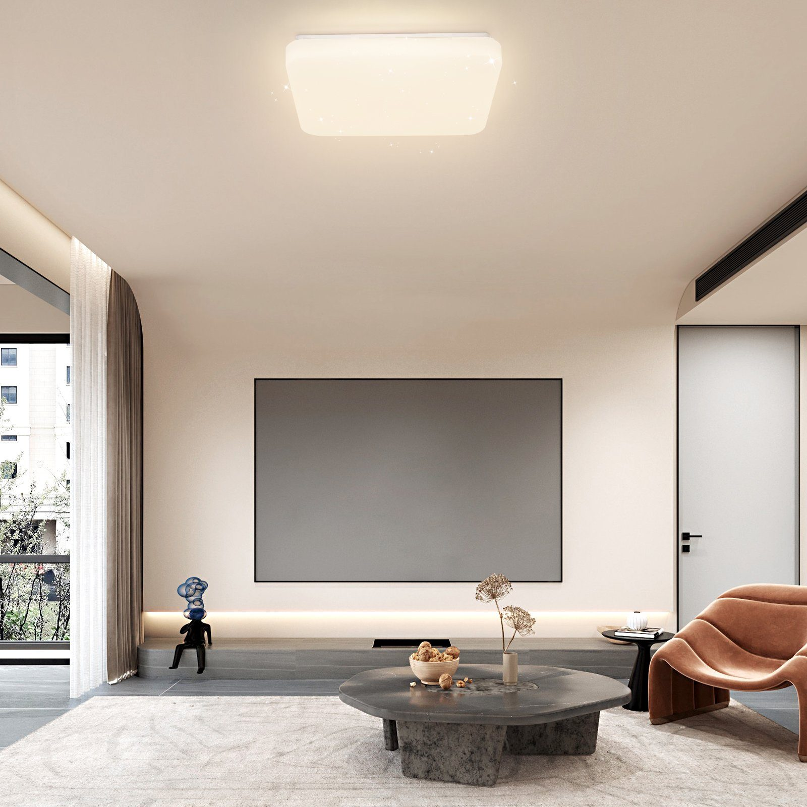 Nowoczesny salon z dużym telewizorem, stolikiem kawowym, sofą i prostokątną lampą sufitową.