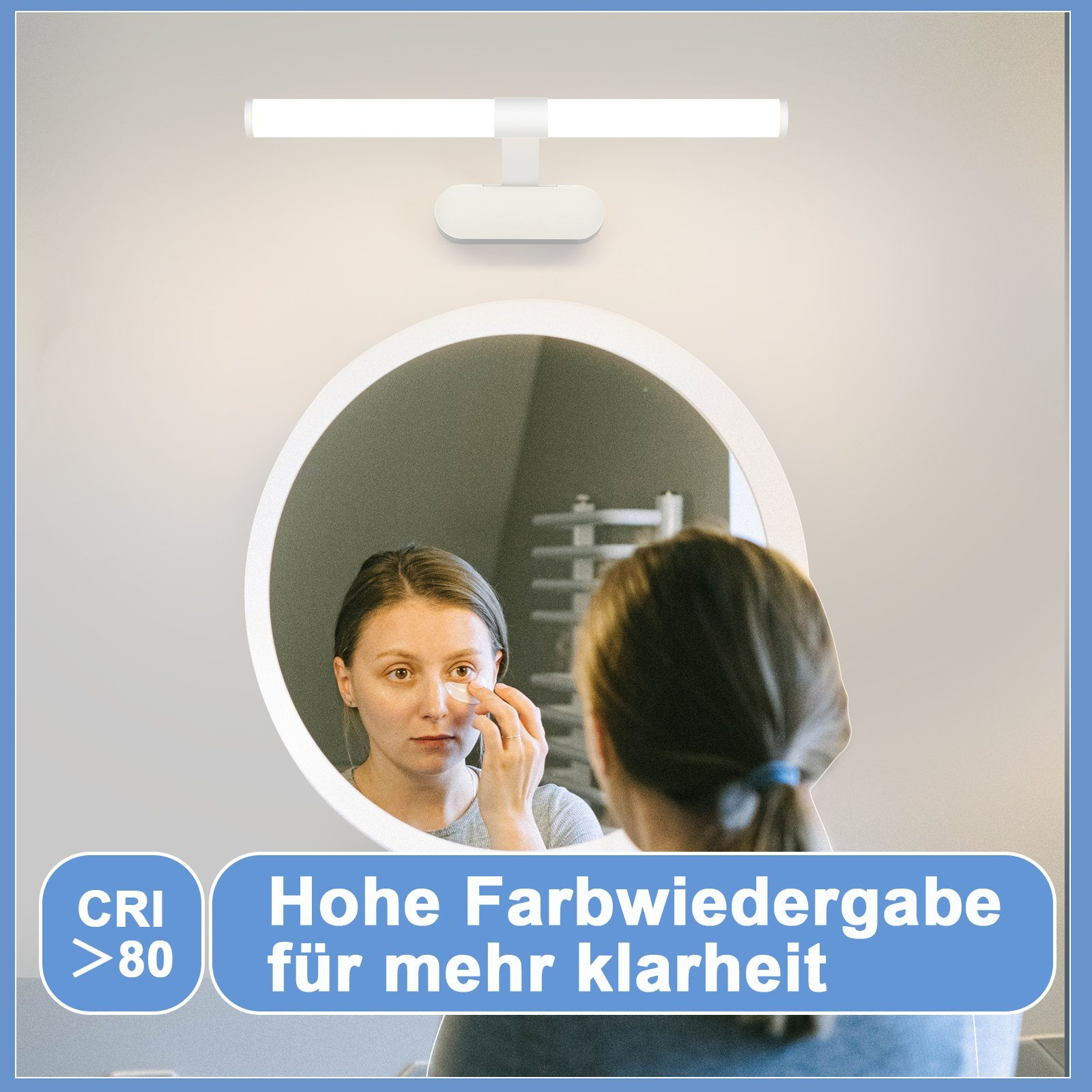 Kobieta nakładająca makijaż przed lustrem, oświetlona białą lampą.