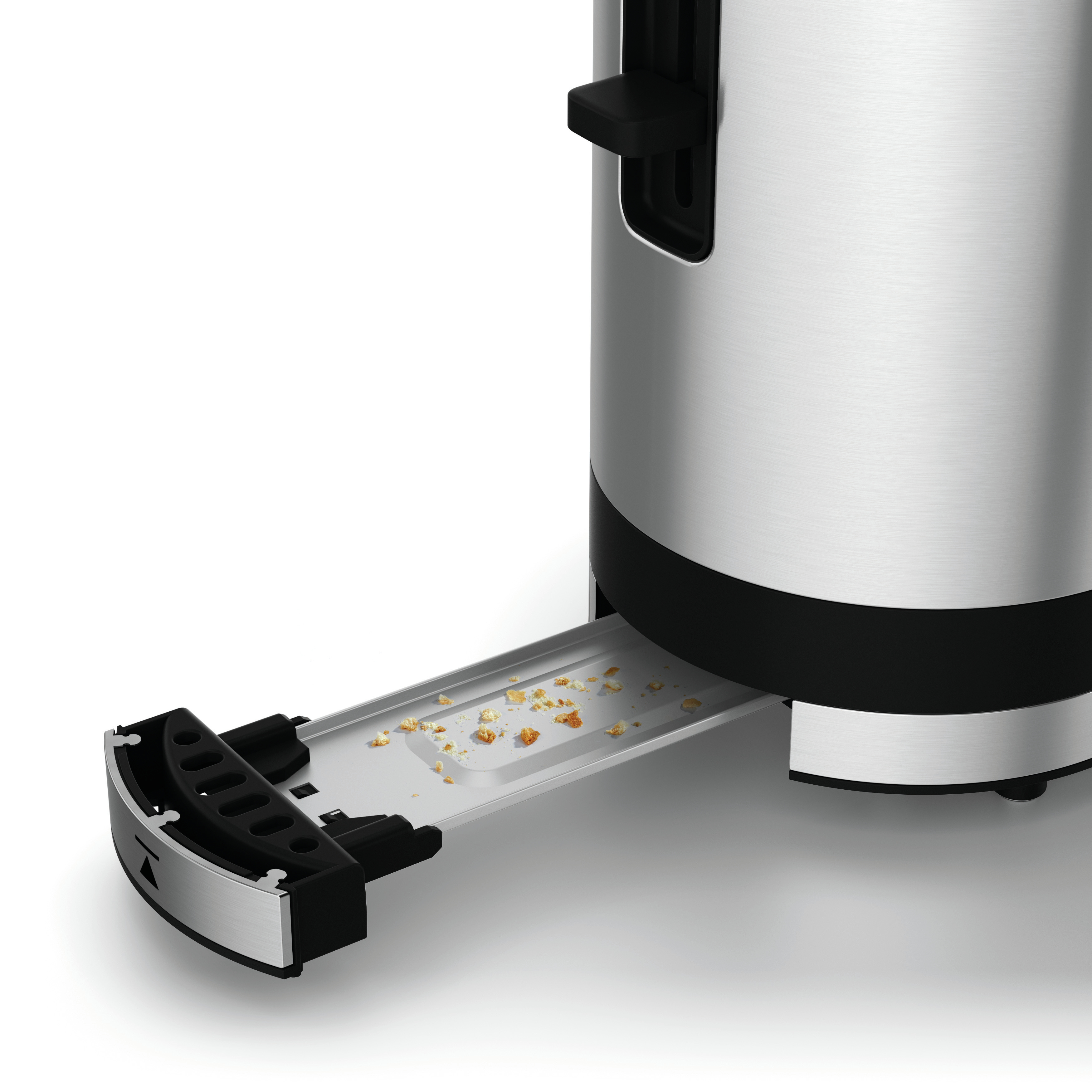 Toster ze stali nierdzewnej z wysuniętą tacką na okruchy, pokazującą okruchy. Białe tło.