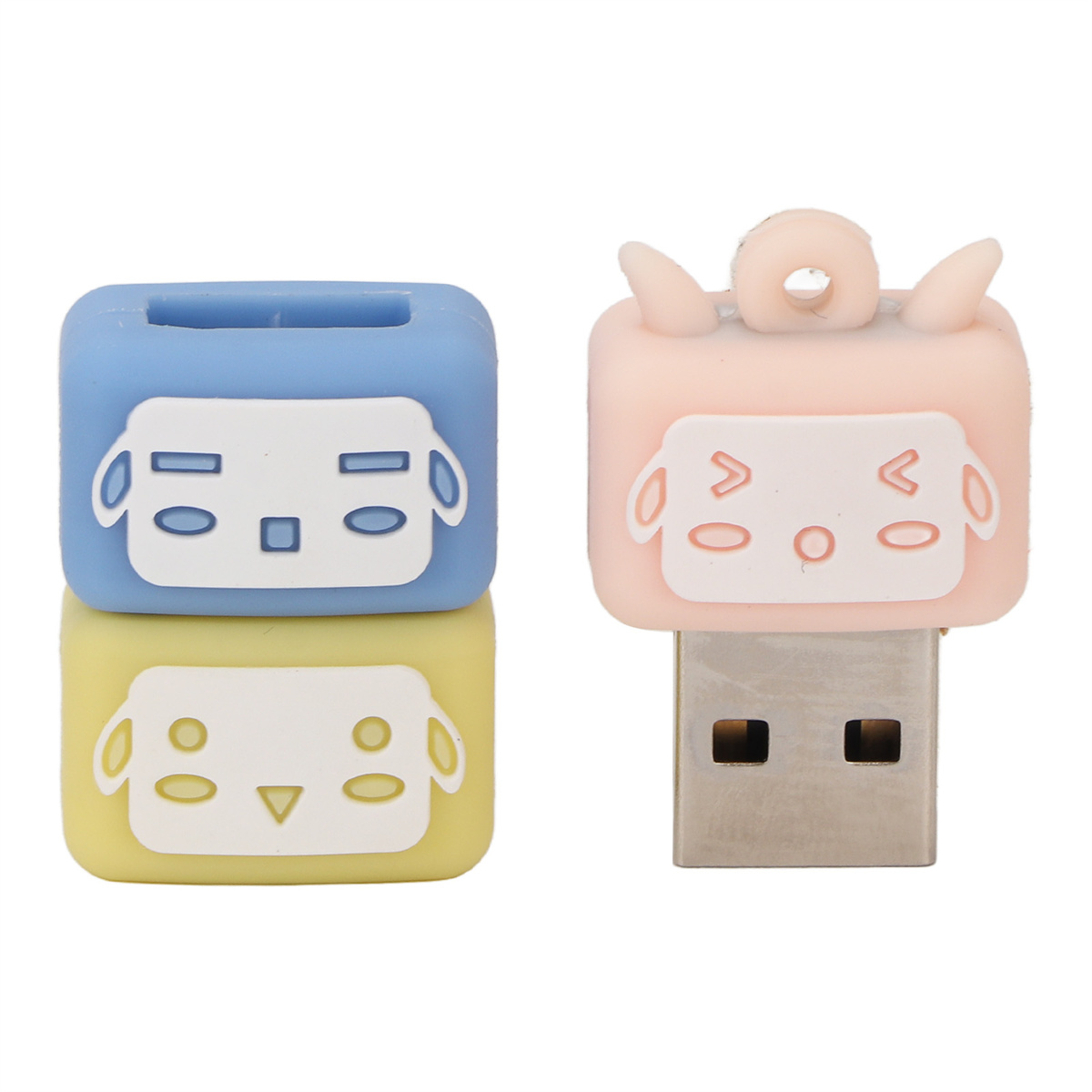 USB-Sticks mit Cartoon-Tiergesichtern, blau, gelb und rosa.