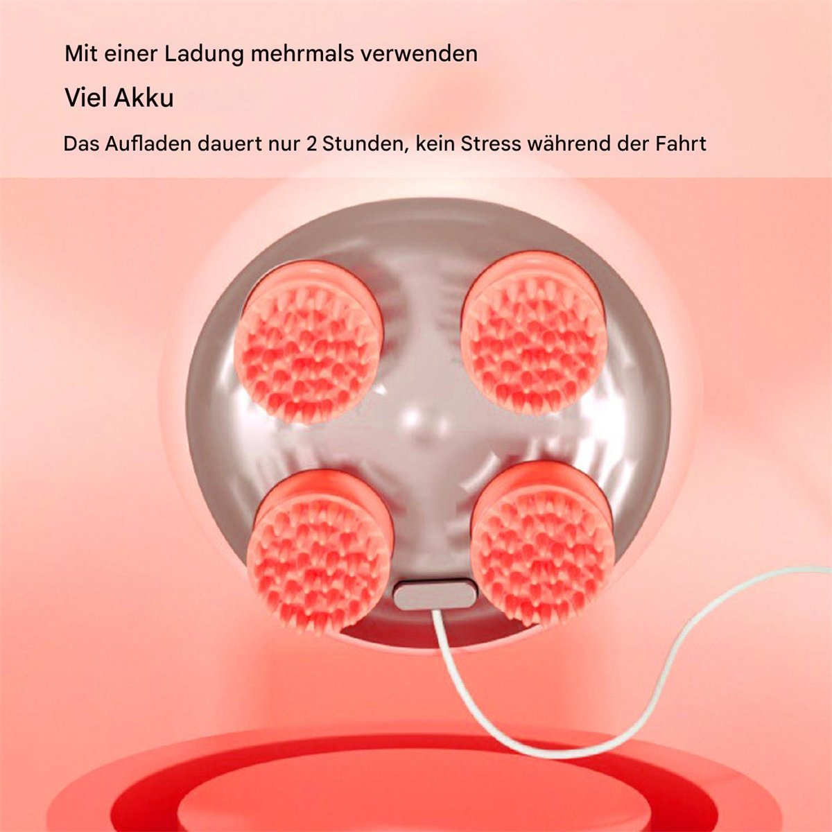 Nahaufnahme eines rosa Massagegeräts mit vier roten Massageköpfen. Rosa Hintergrund, weißes Kabel angeschlossen.