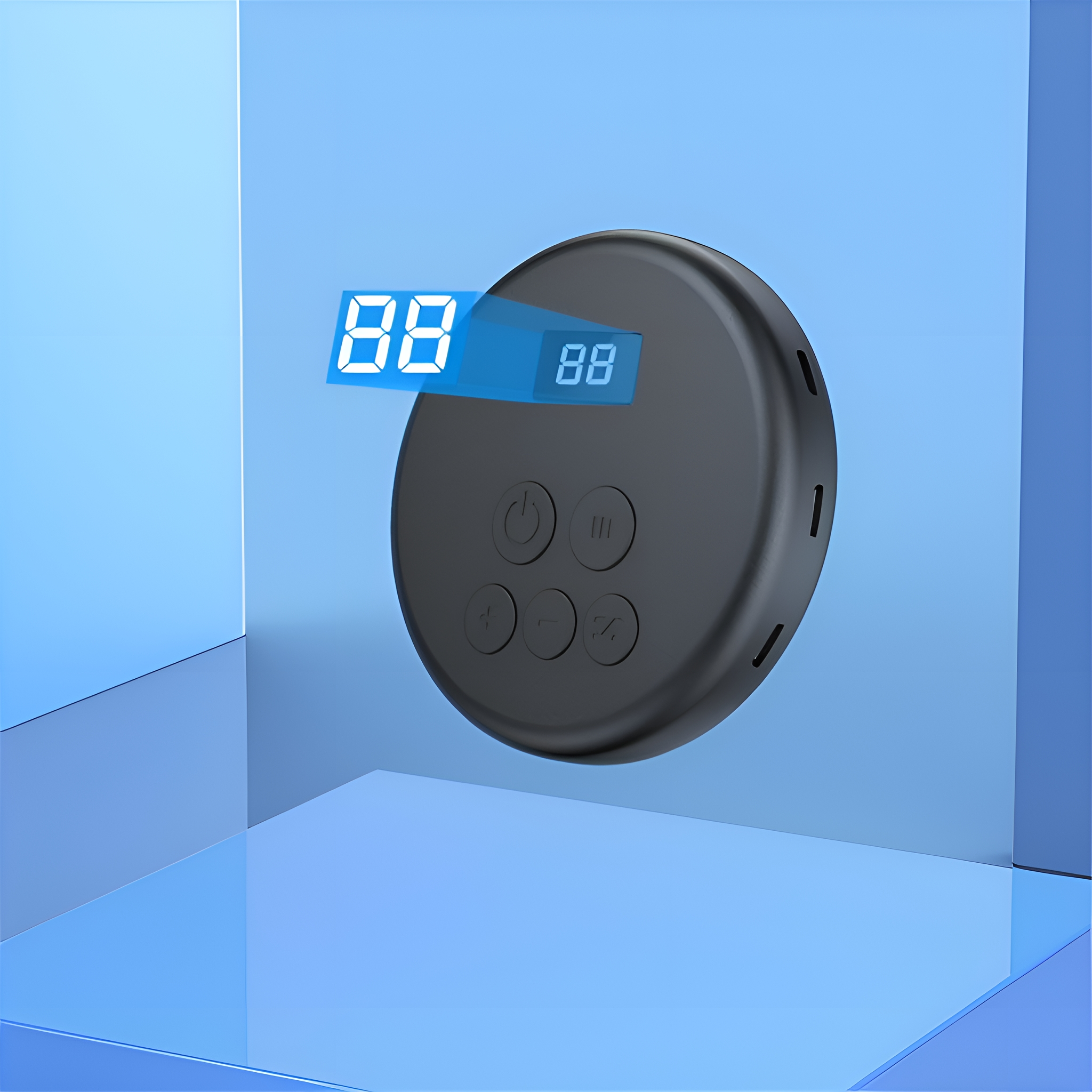 Ein schwarzes Gerät mit Knöpfen und einem Display mit '88'. Es liegt auf einer blauen, glänzenden Oberfläche.