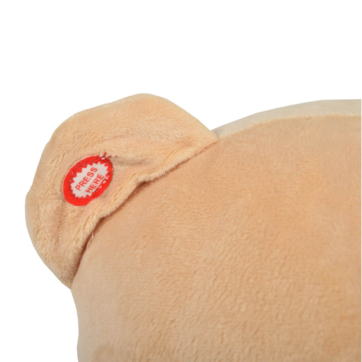 Nahaufnahme des Ohrs eines Plüschteddys mit einem roten „DRÜCKEN SIE HIER“-Knopf.