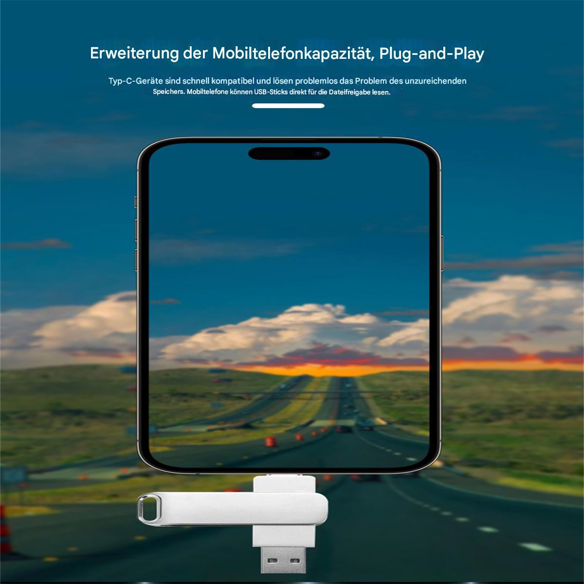 USB-Stick mit Telefonbildschirm, der eine Autobahn zeigt. Der Stick ist weiß mit USB-Anschlüssen.