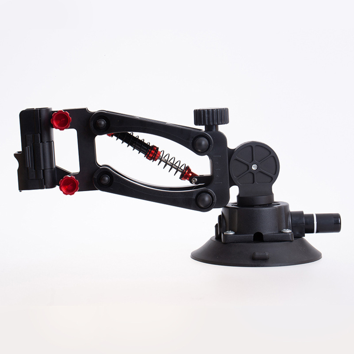 Czarny i czerwony narzędzie z przyssawką. Ma regulowane ramiona i podstawę z przyssawką na białym tle.