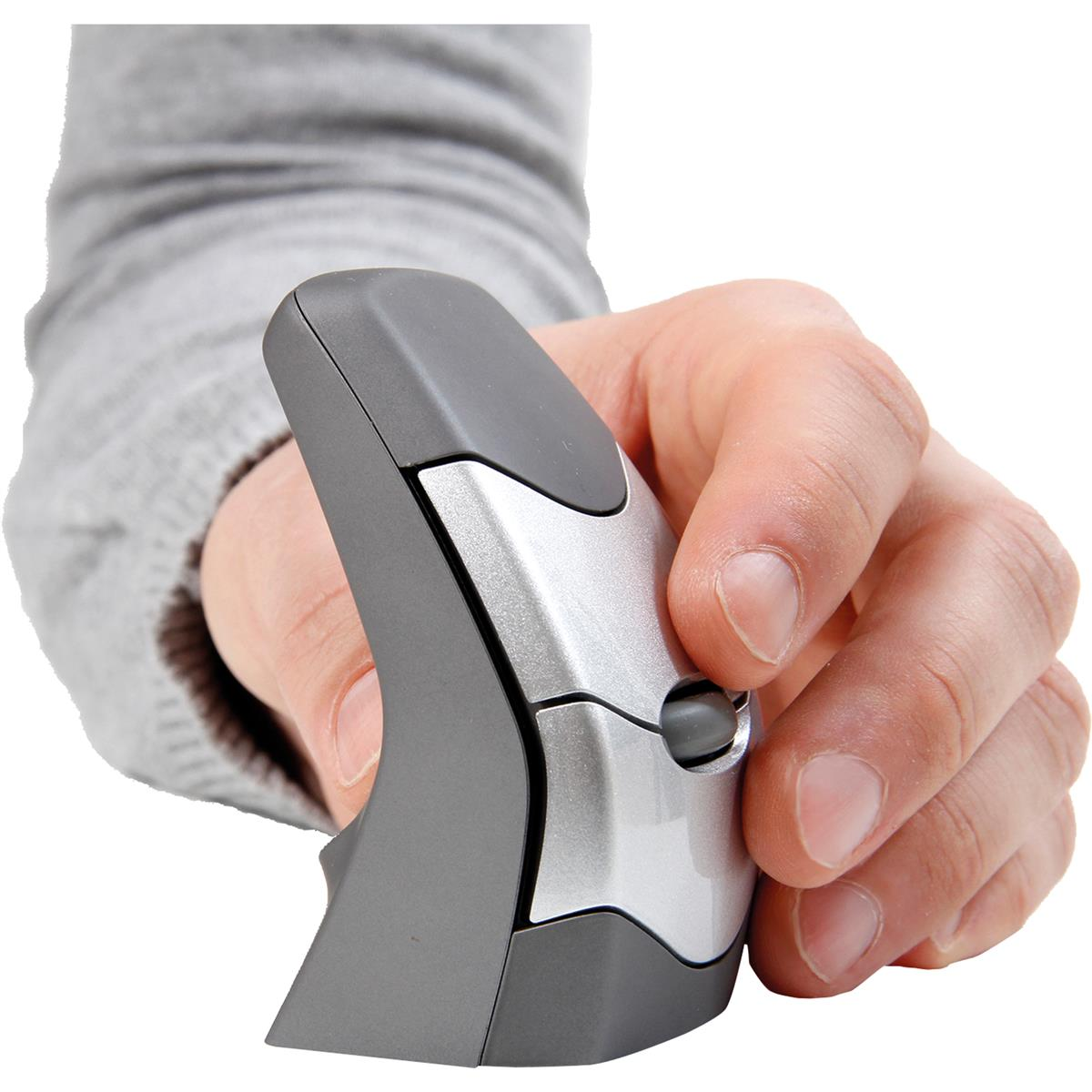 A person's hand holds a gray and silver ergonomic computer mouse.