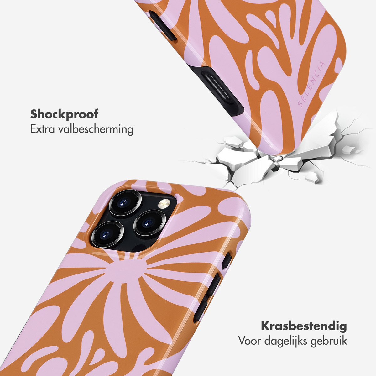 Twee telefoonhoesjes, één valt, bloemenontwerp, bruine en roze kleuren.