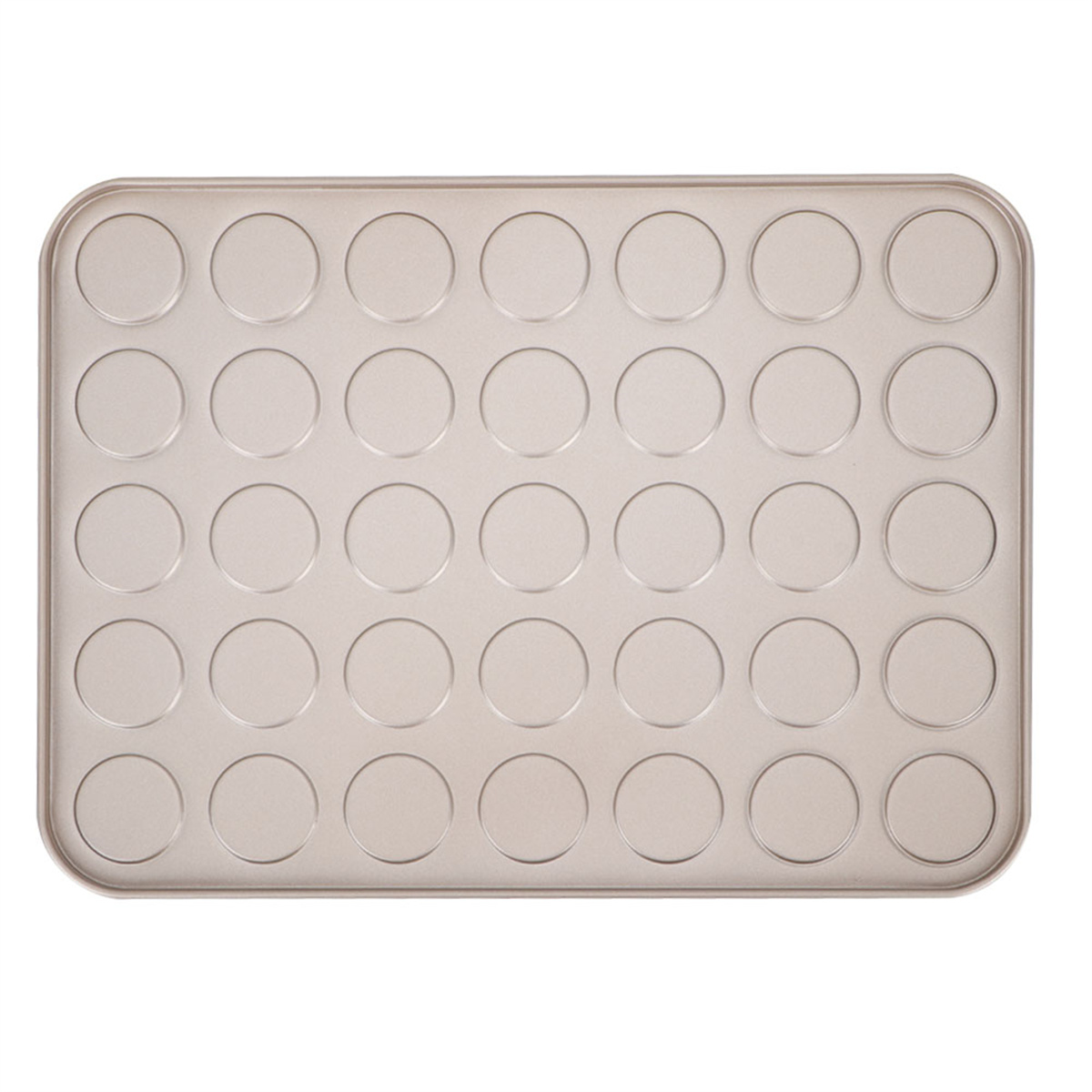 Backblech mit vielen kleinen, kreisförmigen Vertiefungen. Beige. Hintergrund ist weiß.