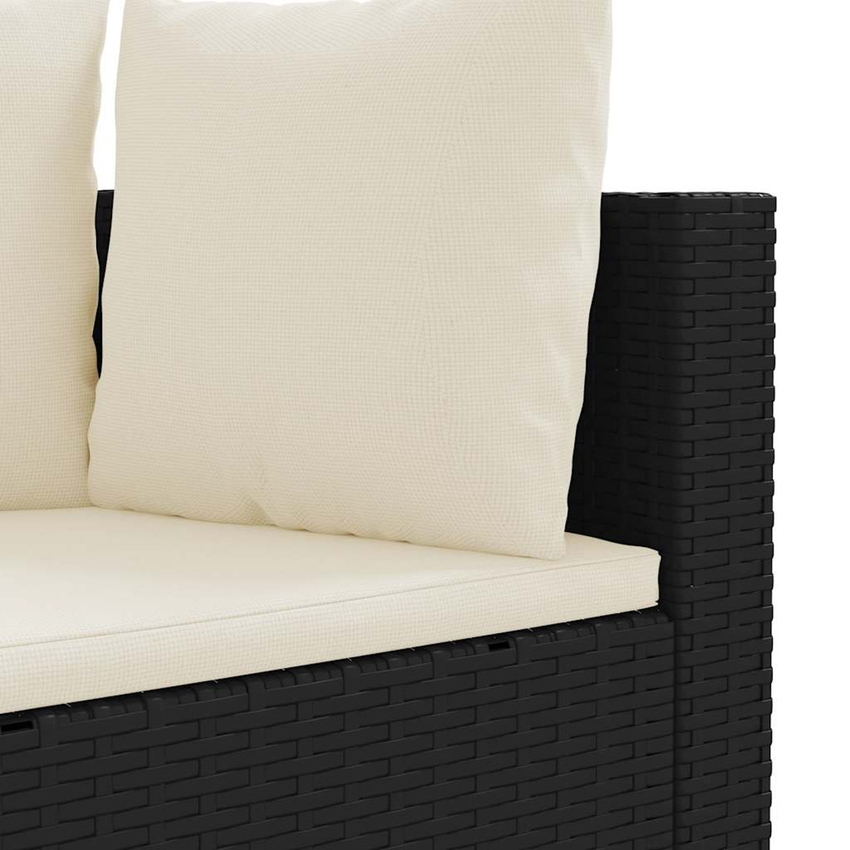 Divano nero e beige con due cuscini, primo piano.