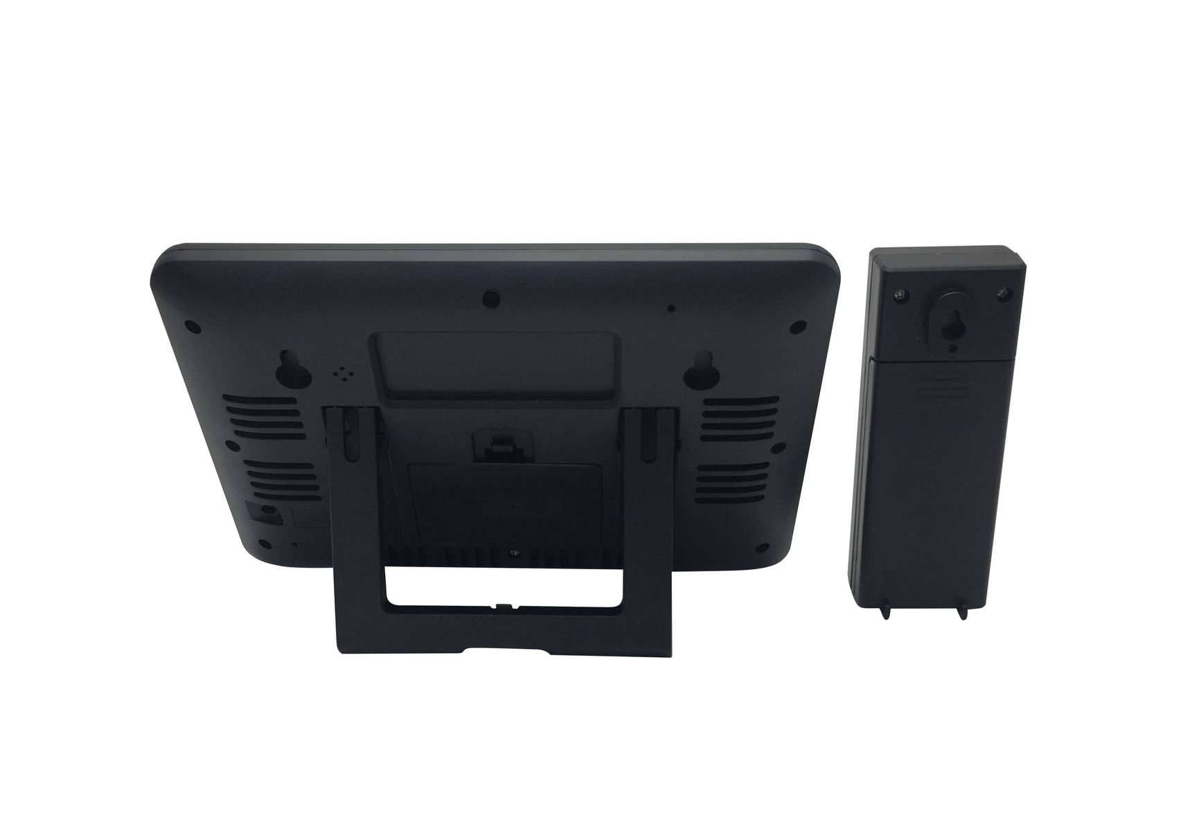 Czarny sprzęt, widok z tyłu. Zawiera podstawkę i oddzielny, mniejszy czarny element.