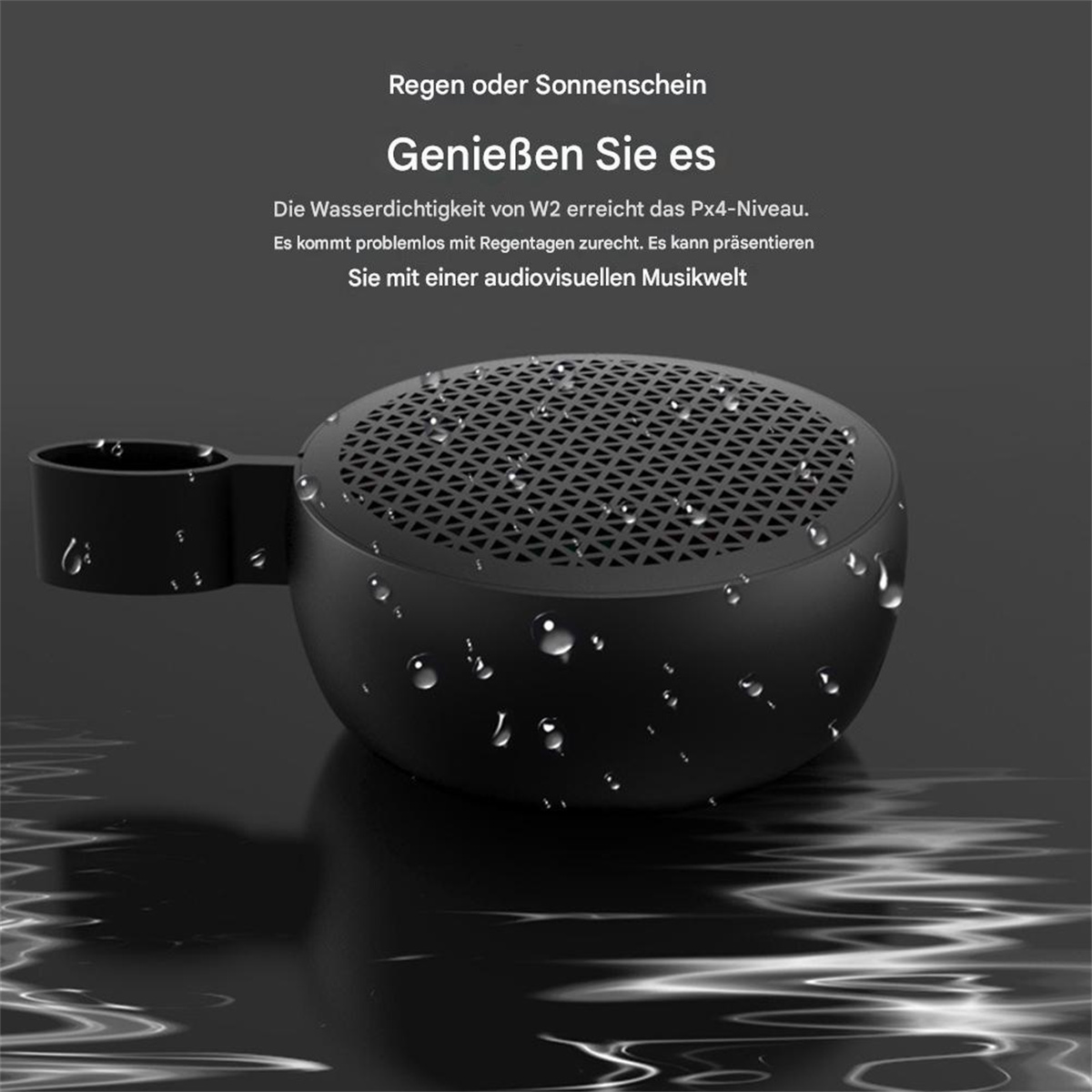 Schwarzer wasserdichter Lautsprecher mit Wassertropfen auf reflektierender Oberfläche.