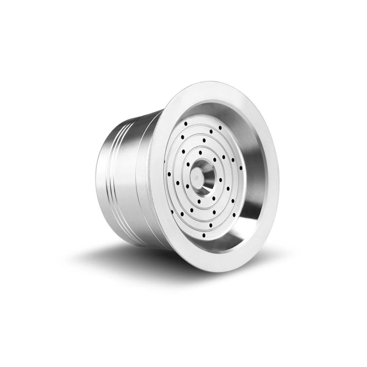Silver coffee capsule with many holes, set against a white background. The capsule is shiny.