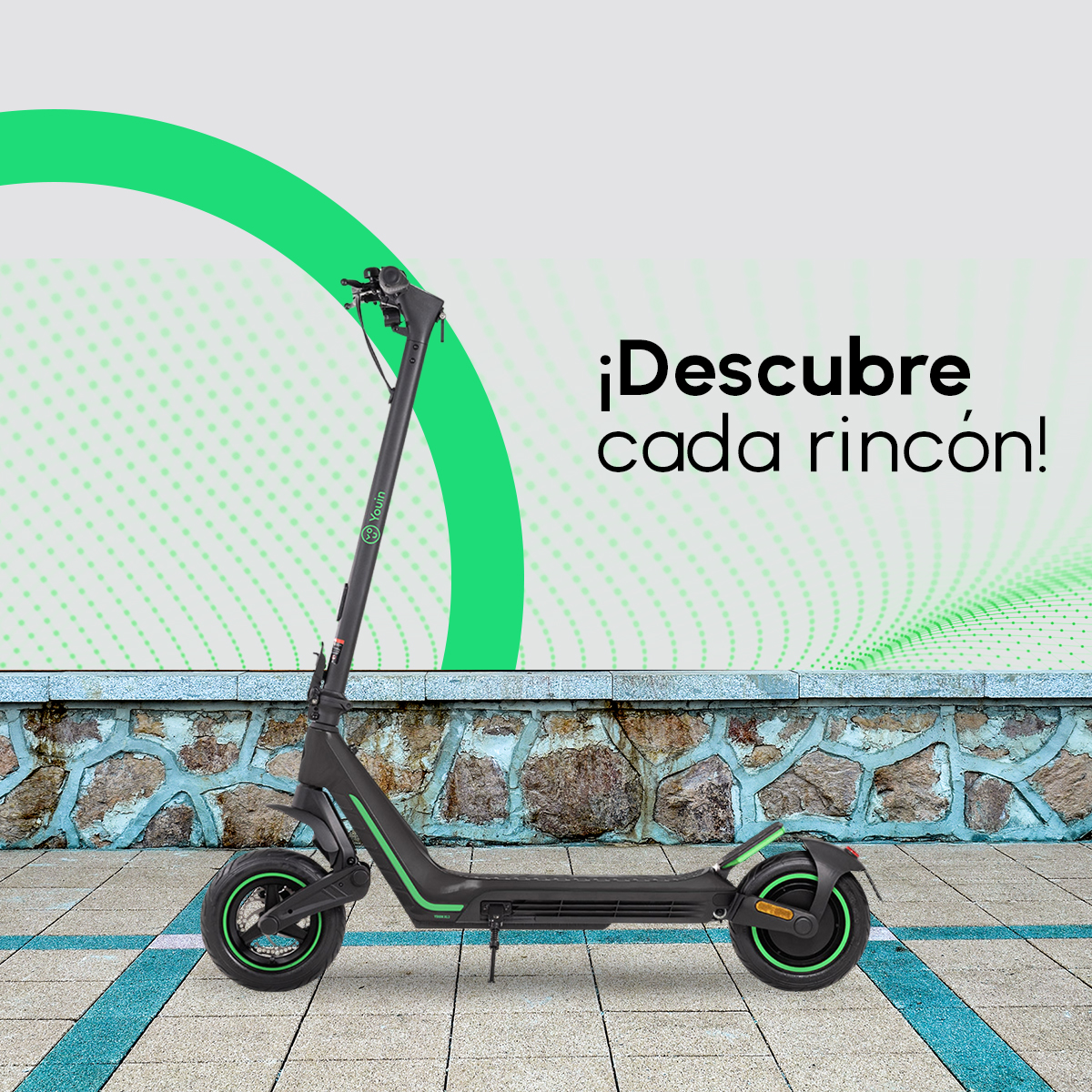 Patinete eléctrico negro y verde con fondo de piedra.