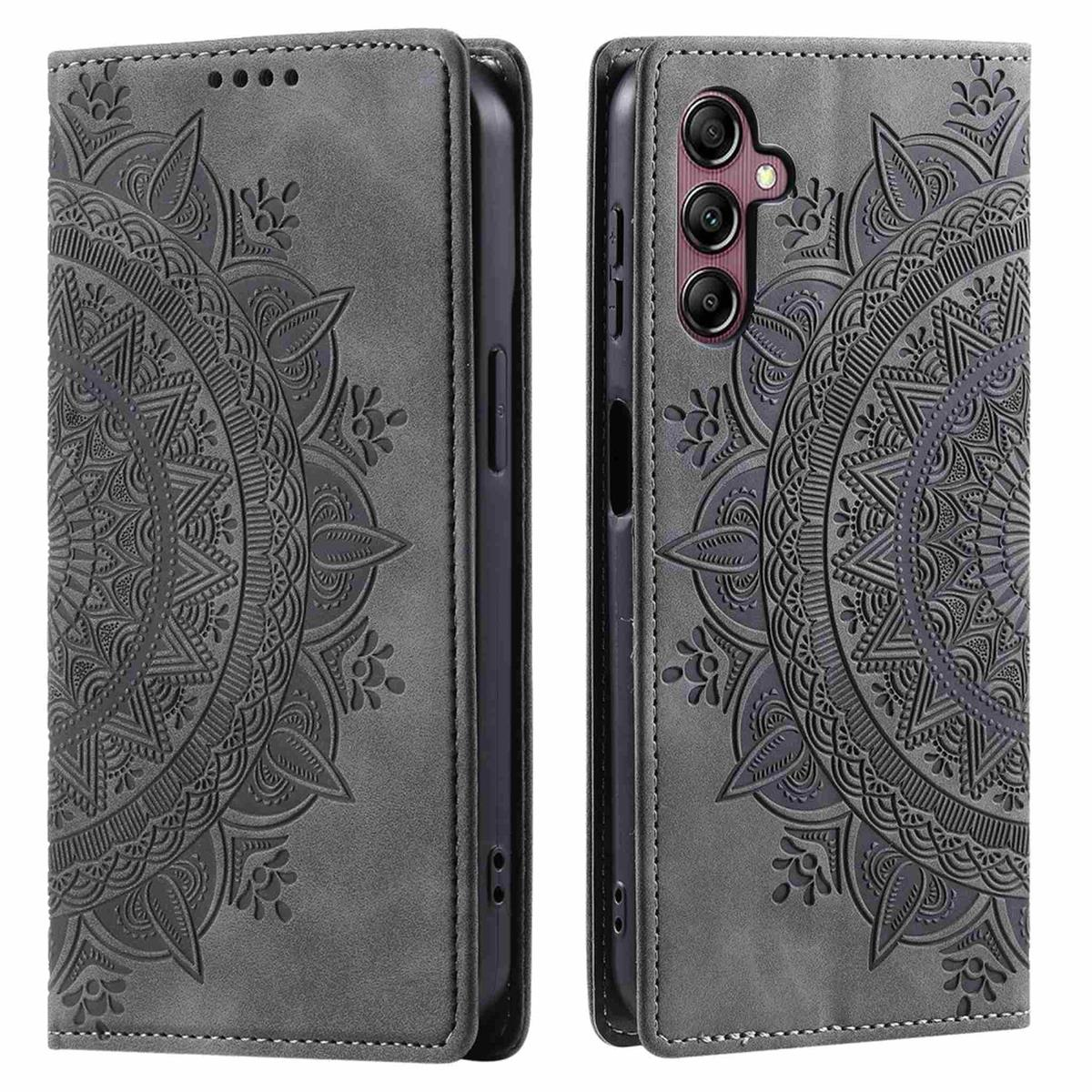 Eine graue Handyhülle, offen, um ein Handy zu zeigen. Aufwendiges Blumendesign. Hülle steht aufrecht.