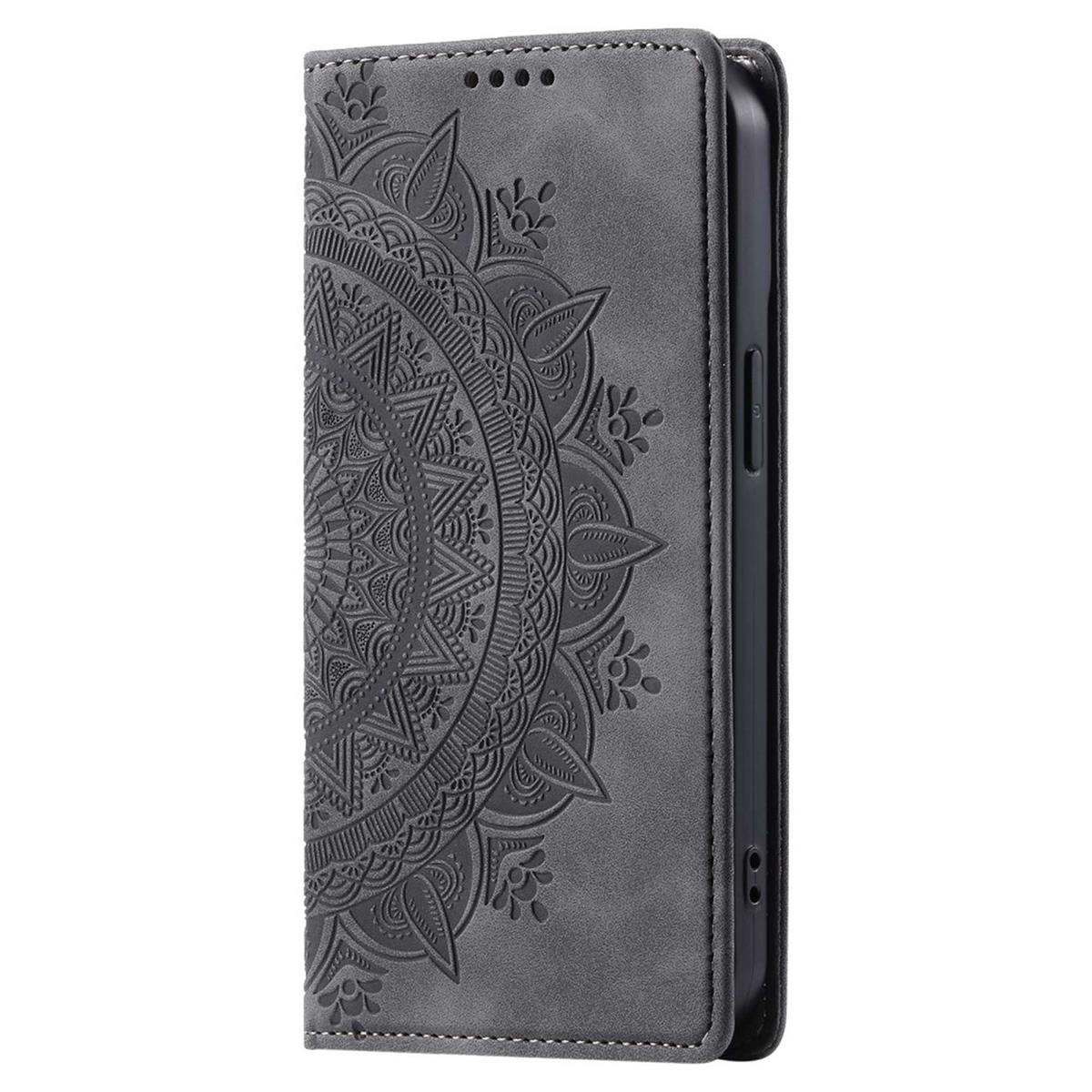 Eine graue Handyhülle mit Mandala-Design und einem schwarzen Telefon darin.