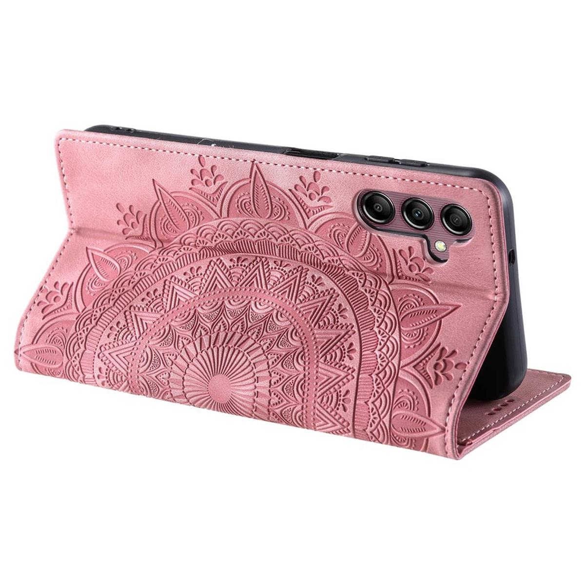 Rosa Leder-Handyhülle mit Mandala-Design. Geöffnete Handyhülle mit Telefon darin.