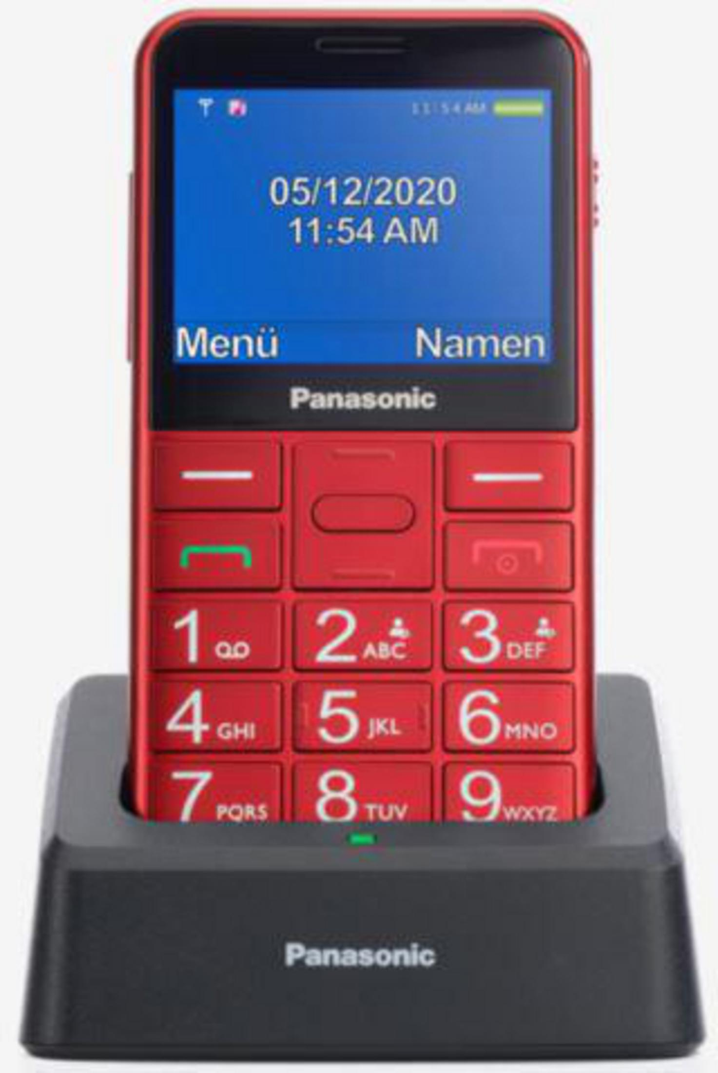Rotes Klapphandy in einer schwarzen Ladestation. Anzeige zeigt Datum, Uhrzeit und Text.
