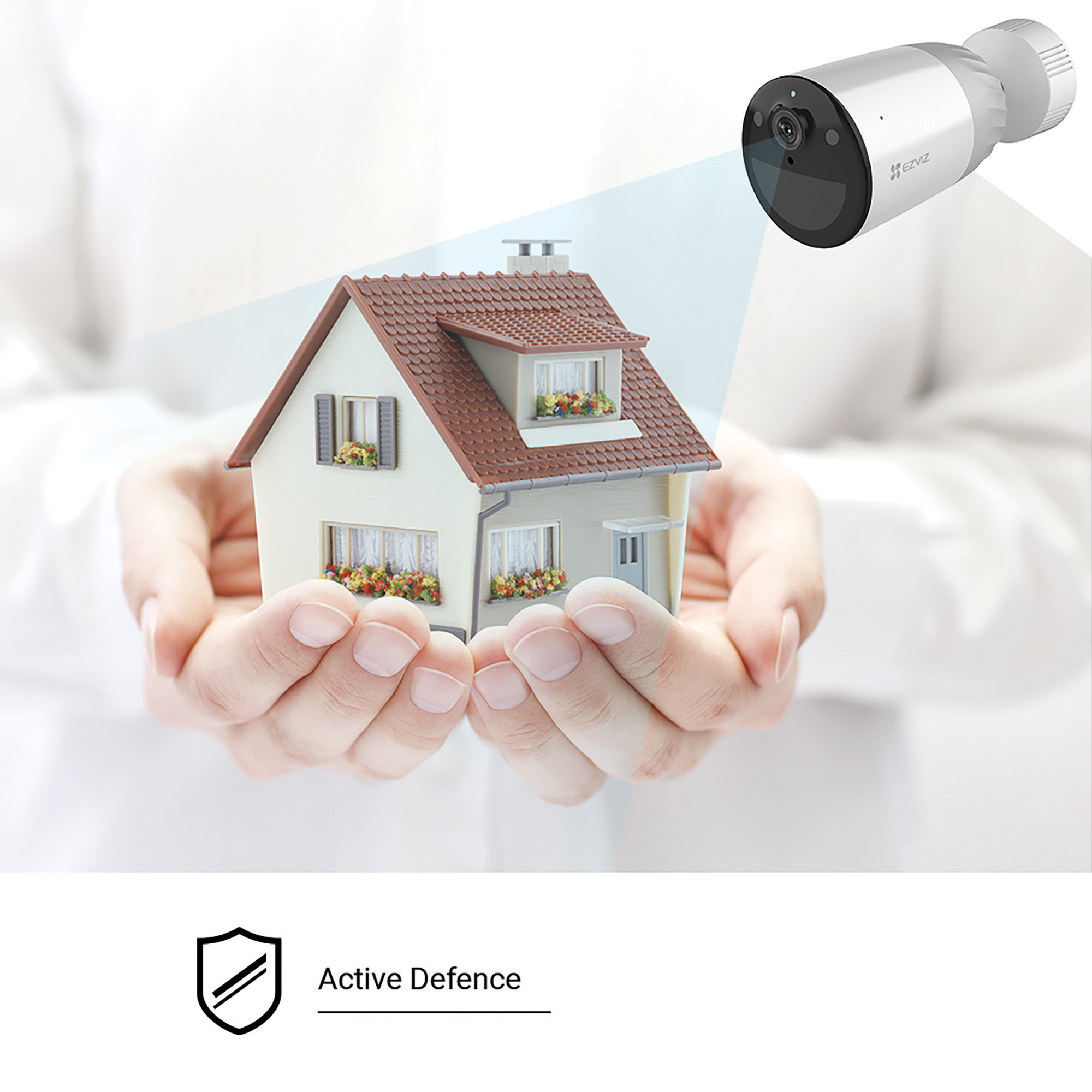 Kamera bezpieczeństwa skierowana na dom, tekst brzmi Aktywna Obrona.