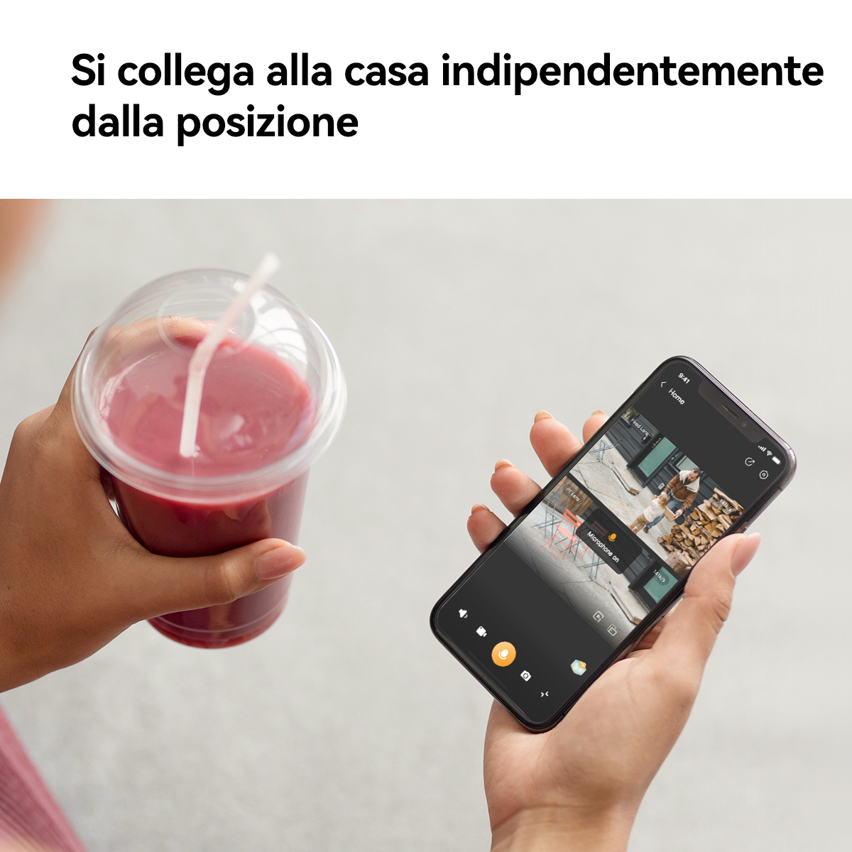 Osoba trzymająca koktajl i telefon z aplikacją kamery bezpieczeństwa.