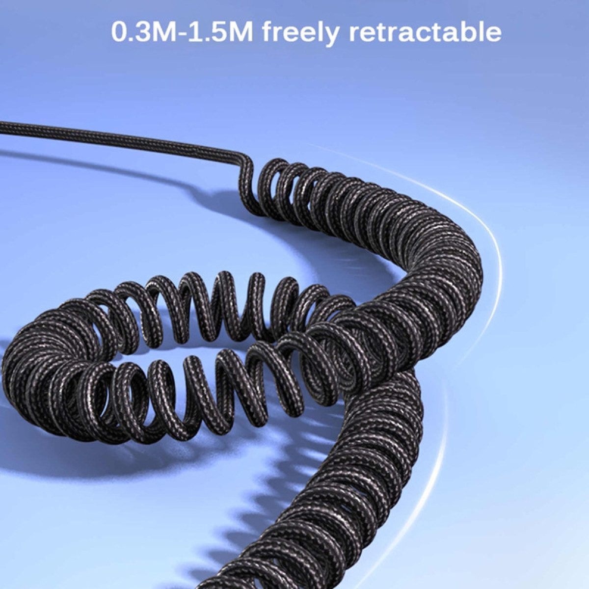 Czarny zwinięty kabel na niebieskim tle. Kabel jest skręcony.