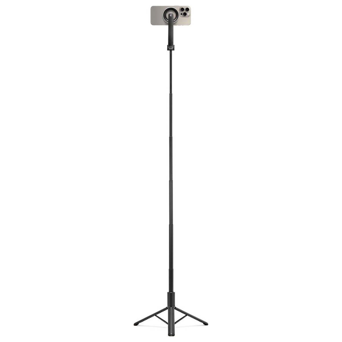 A smartphone mounted on a tall, black, telescopic selfie stick tripod, standing upright.