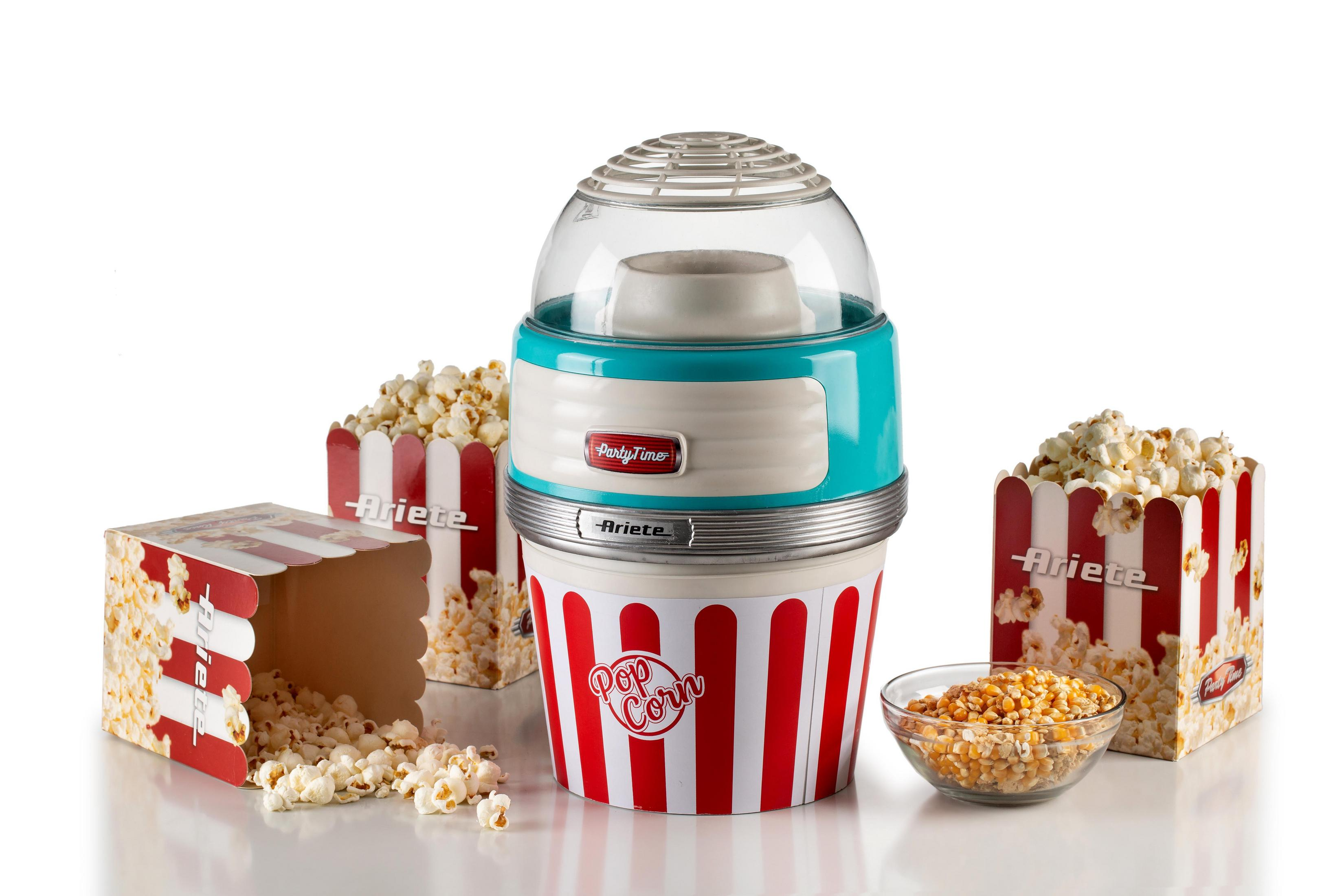 Popcornmaschine mit Popcornboxen, Popcornkörnern und mit Popcorn gefüllten Boxen.