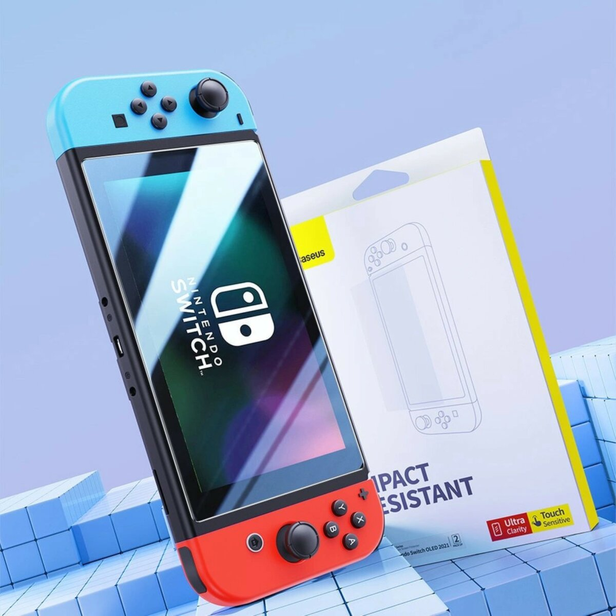 Console Nintendo Switch con custodia blu/rossa e una scatola con protezione schermo.