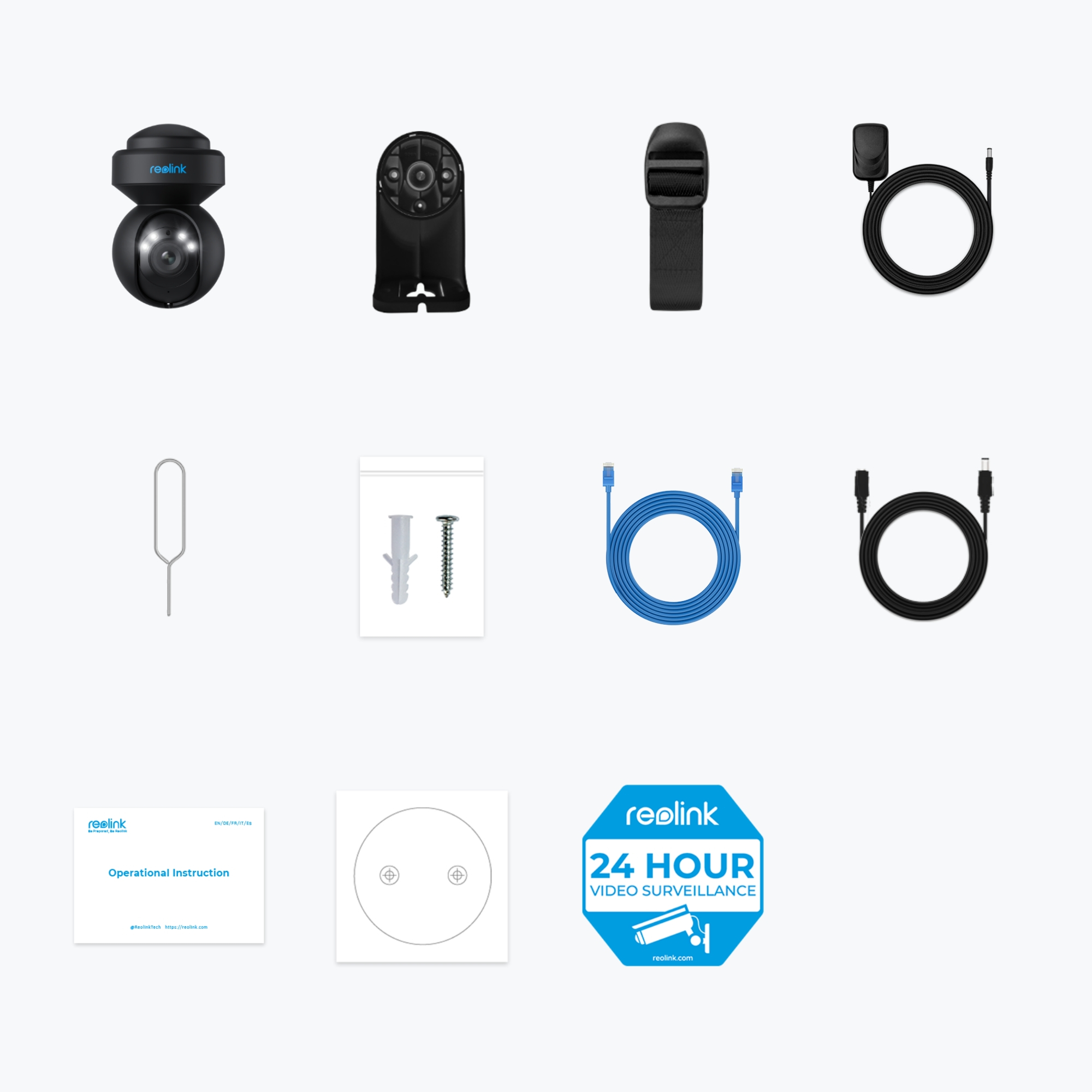 Różne komponenty kamery bezpieczeństwa na białej powierzchni, w tym kamera i kable.