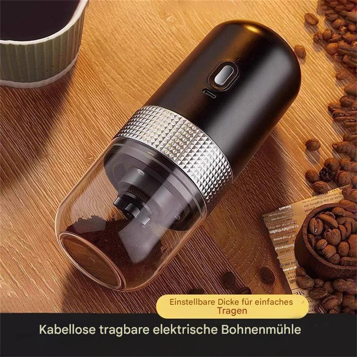 Schwarze tragbare Kaffeemühle mit einem Glasbehälter für gemahlenen Kaffee und Kaffeebohnen.