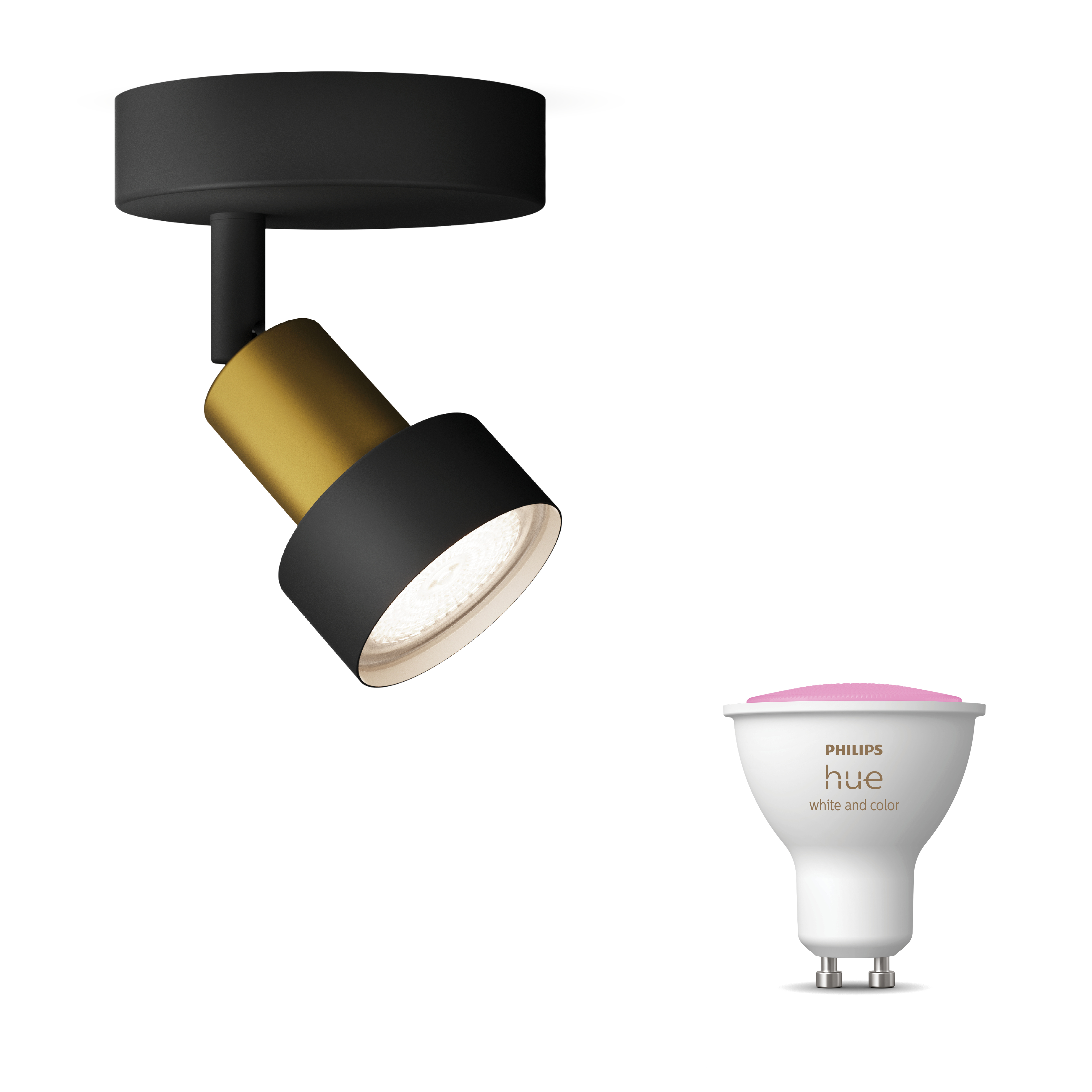 Un spot noir et doré, une ampoule intelligente Philips Hue blanche et rose.