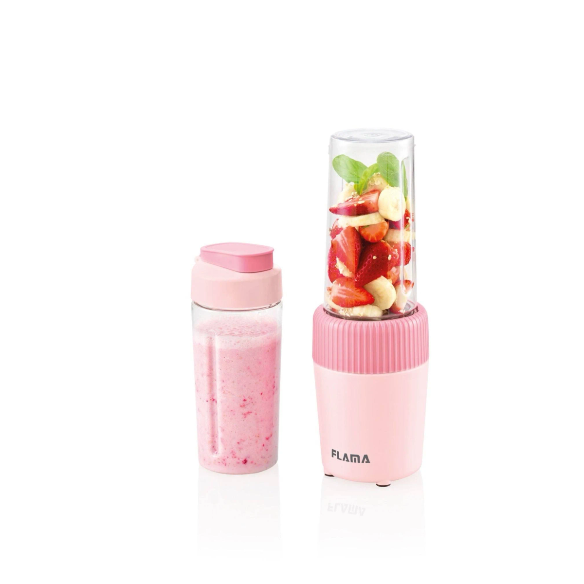 Frullatore rosa con un barattolo pieno di frutta e un bicchiere di frullato rosa.