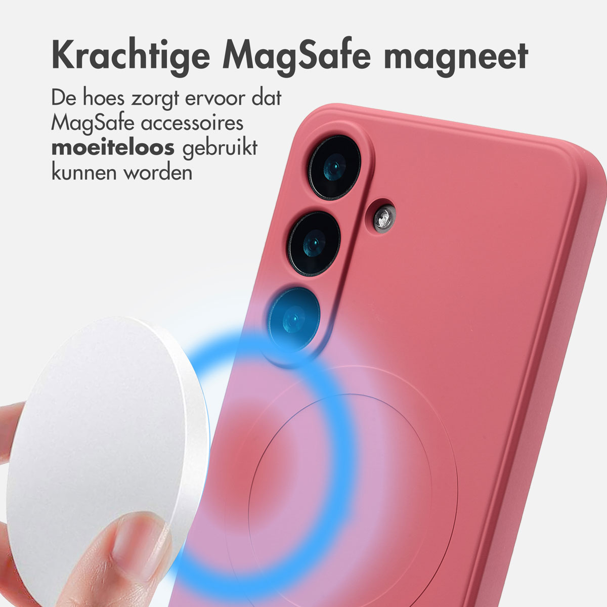 Een roze telefoon met hoesje en een witte MagSafe-lader. Blauwe ring eromheen.