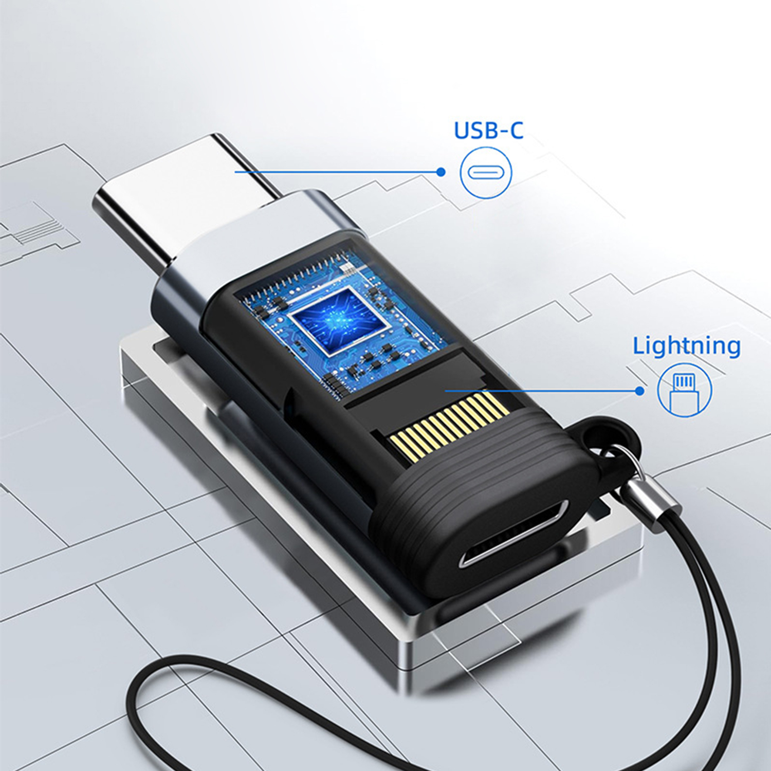 Adapter USB-C na Lightning. Czarny korpus, srebrne końcówki. Układ w środku.