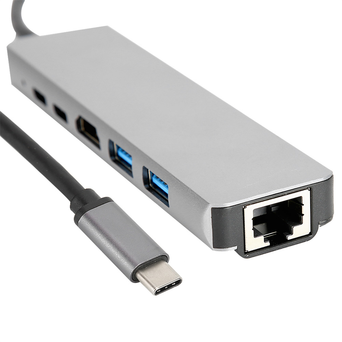 Ein silberner USB-C-Hub mit mehreren Anschlüssen und einem schwarzen Kabel.