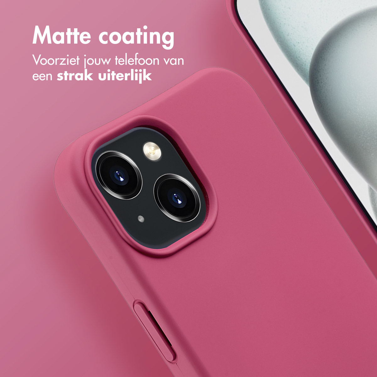 Nahaufnahme einer magentafarbenen Handyhülle mit sichtbaren Kameralinsen, die auf eine matte Oberfläche hindeuten.