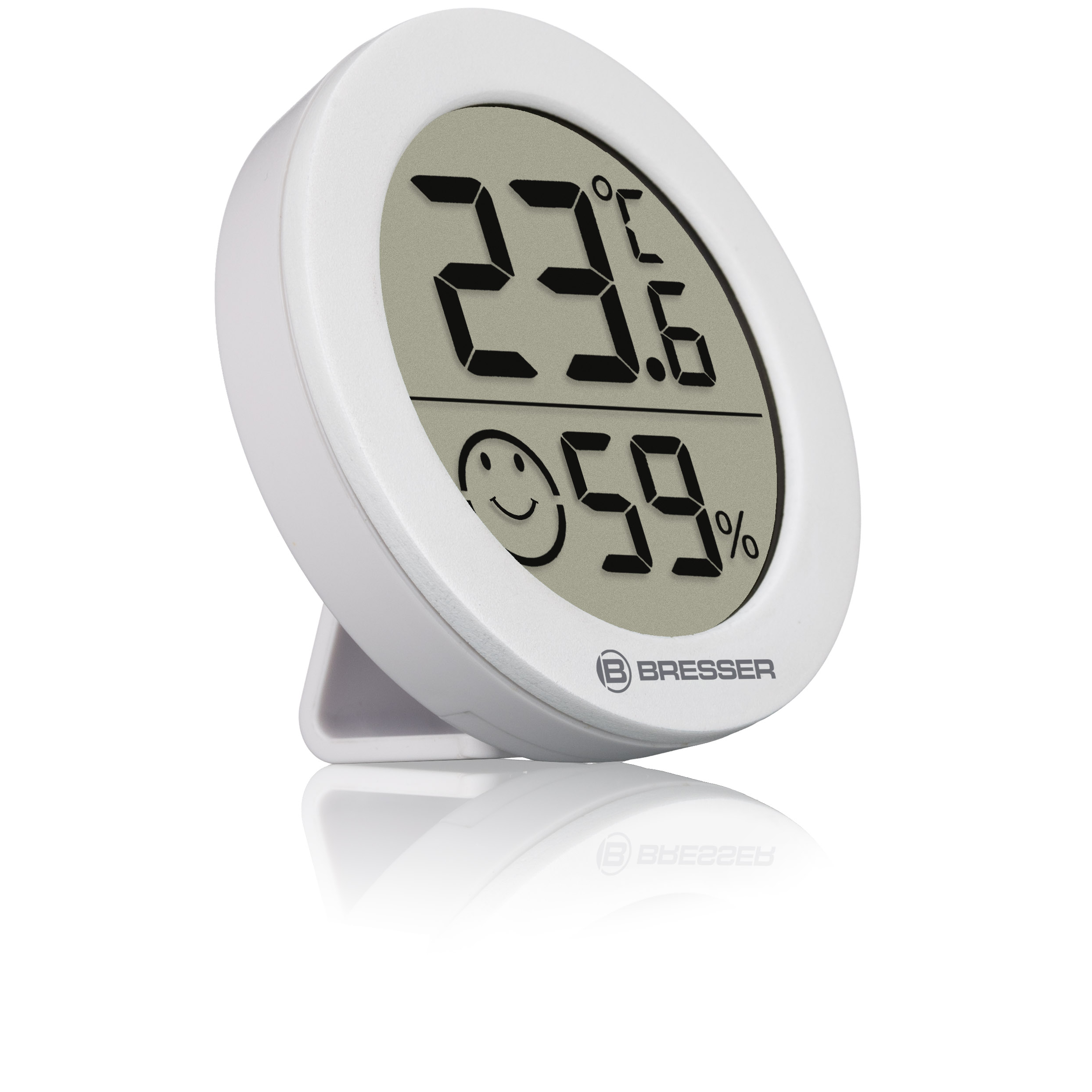 Termómetro digital blanco que muestra 23.6°C y 59%. También se muestra una cara sonriente.