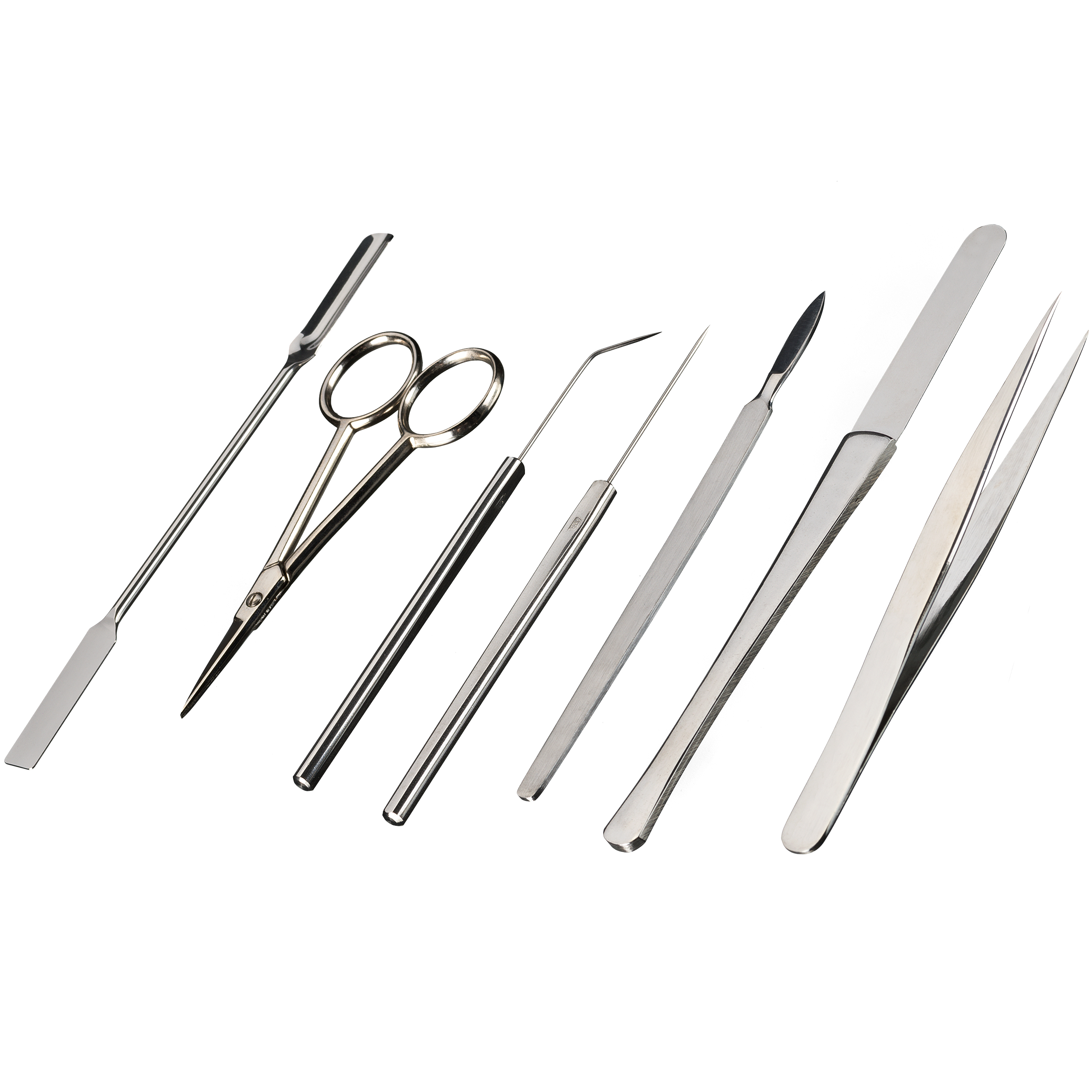Varias herramientas quirúrgicas de acero inoxidable, incluyendo tijeras, pinzas y bisturís.