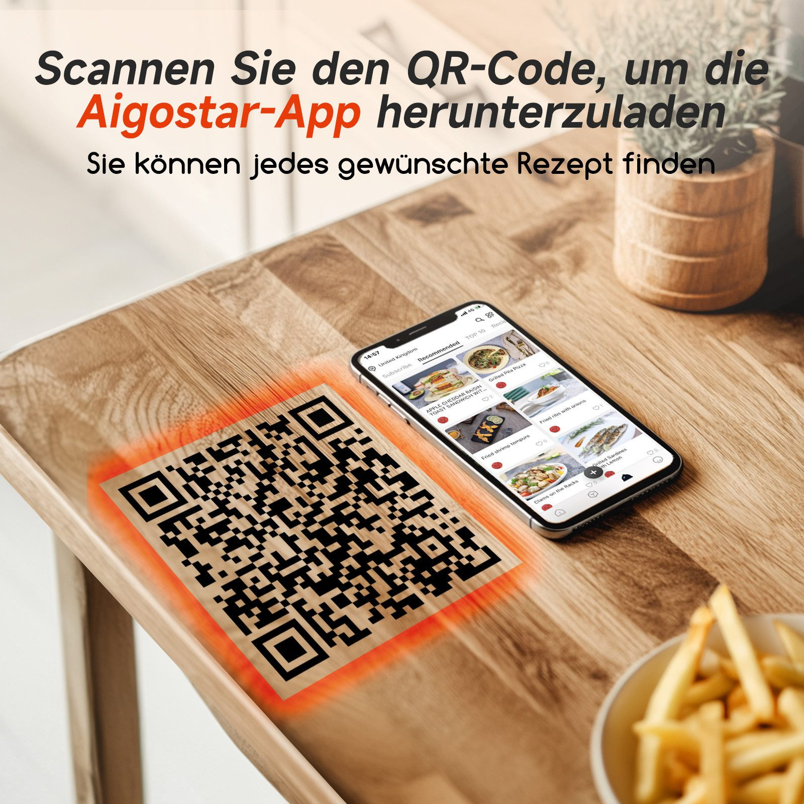 Ein QR-Code auf einem Holztisch neben einem Smartphone, das eine Rezept-App anzeigt. Pommes in einer Schüssel.