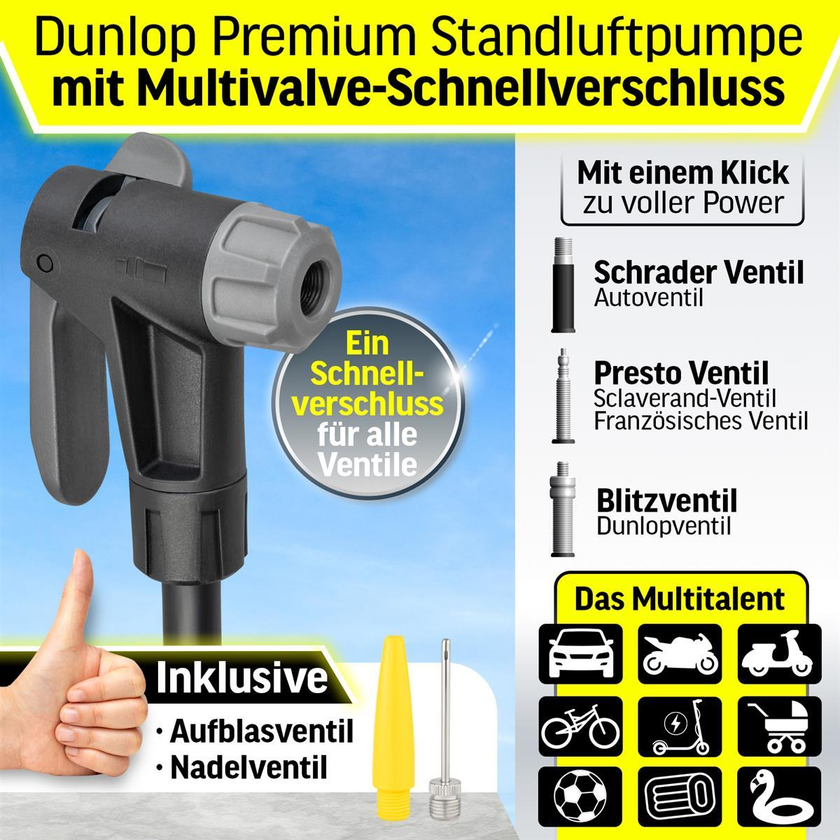 Eine schwarz-graue Fahrradpumpe mit verschiedenen Ventilaufsätzen und einer Hand, die die Pumpe hält.