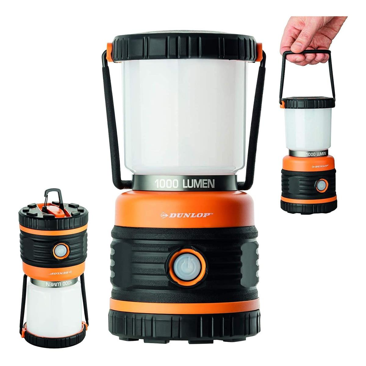 Drei Lampen mit gleichem Design, eine wird gehalten, die anderen beiden stehen. Alle sind schwarz und orange.