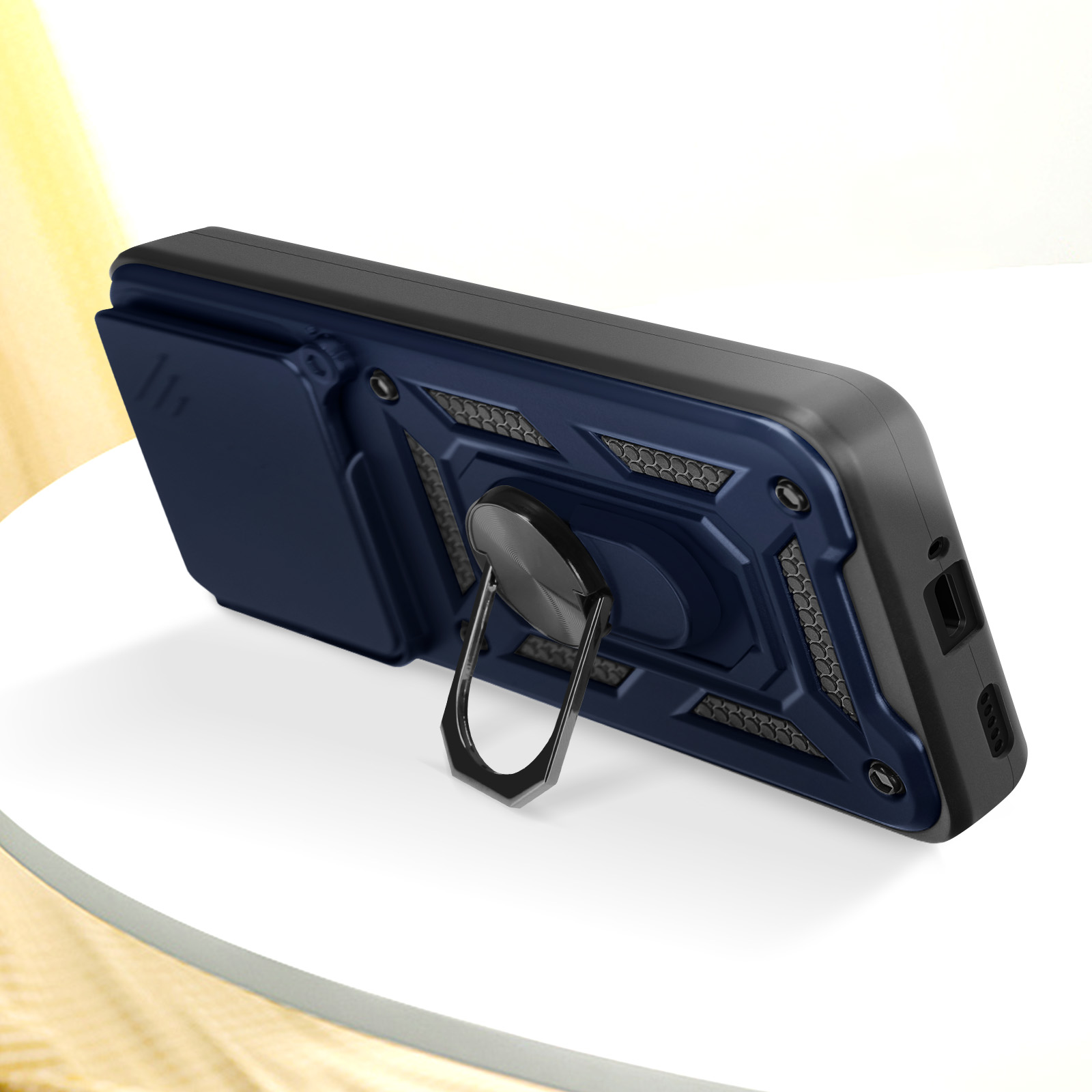 Una custodia per telefono blu navy con un porta anello, appoggiata su una superficie bianca. Il pannello posteriore ha un design strutturato.