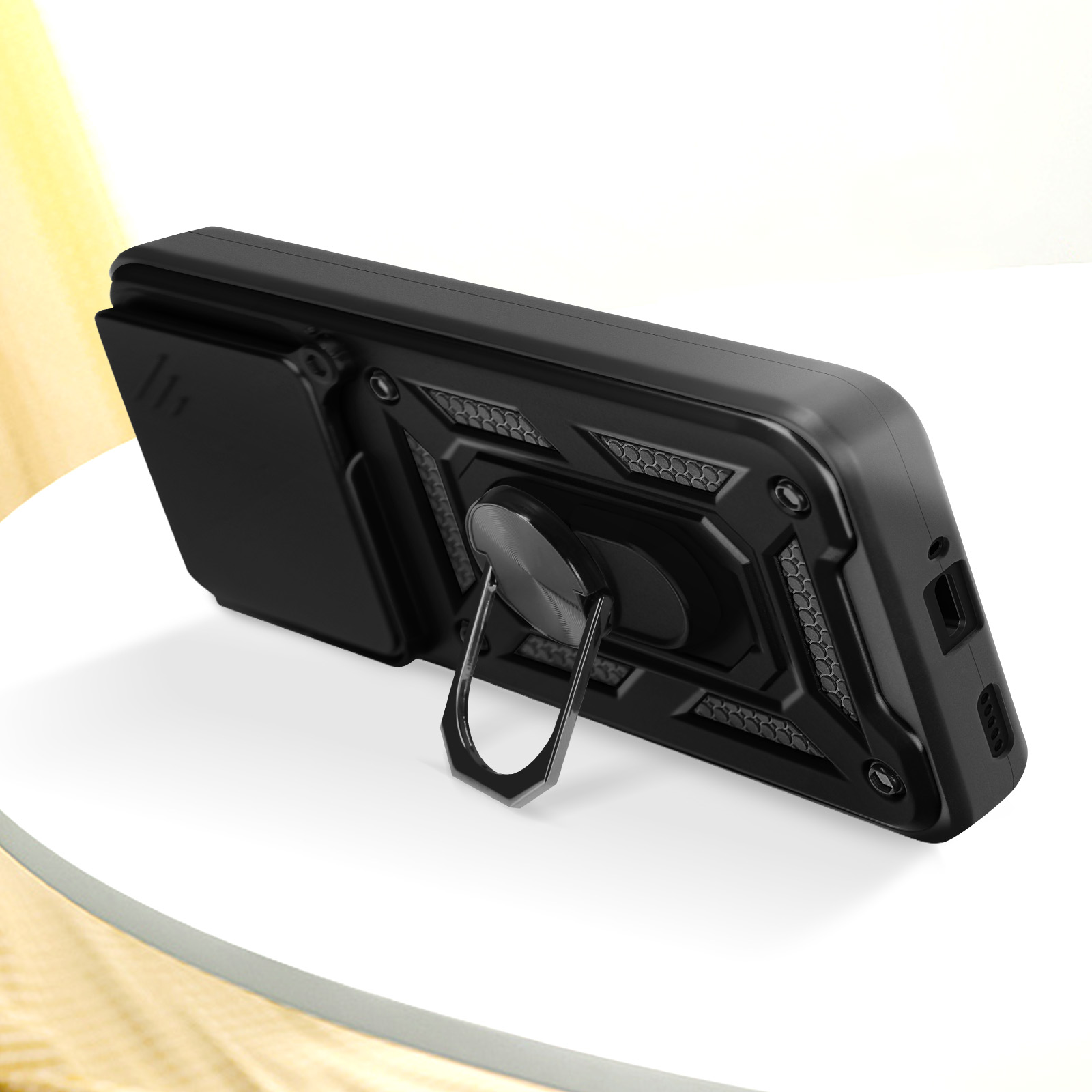 Custodia nera per telefono con anello di supporto e copertura scorrevole per la fotocamera, su superficie bianca.